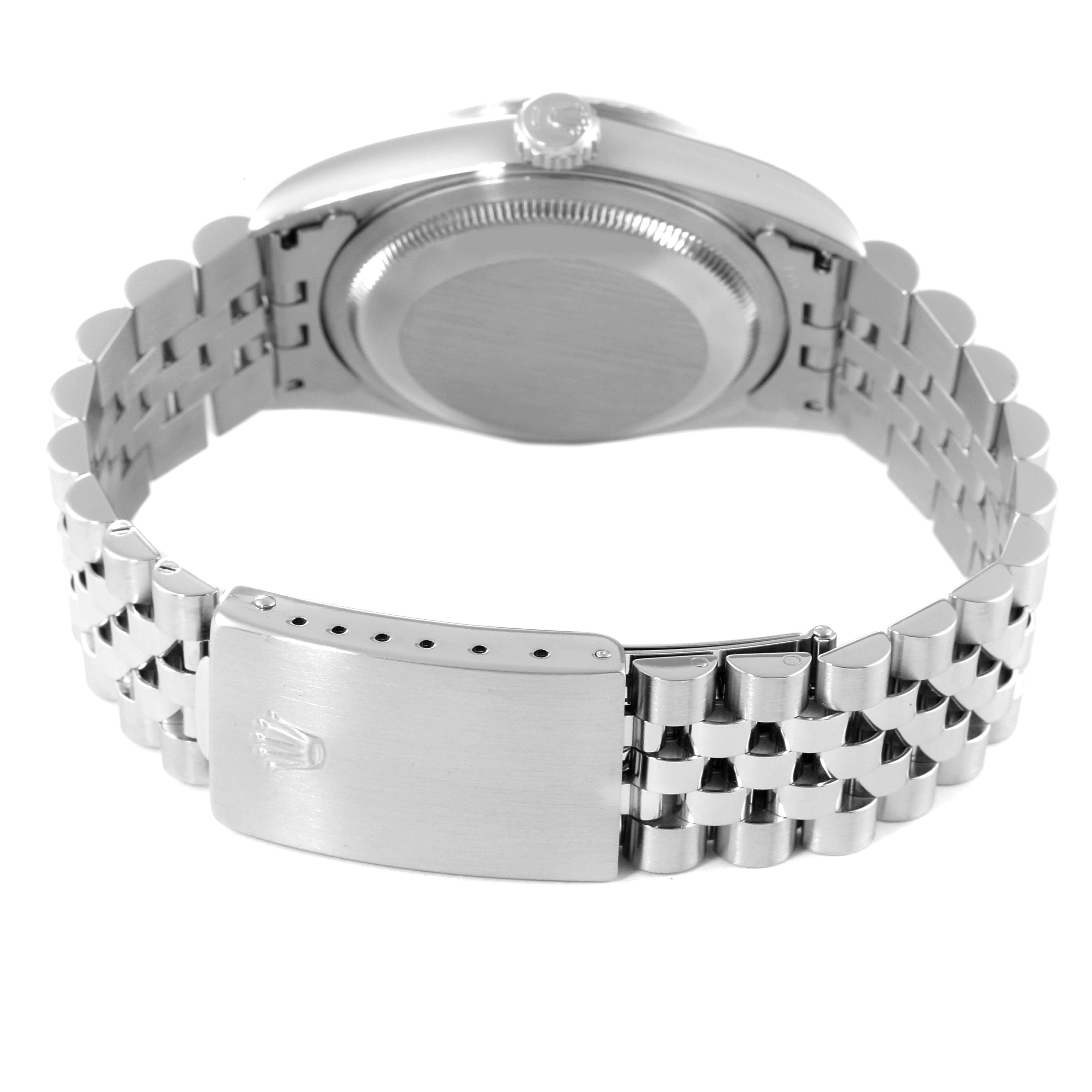 The image shows the back of a Rolex Datejust 16220 Men's Stainless Steel Blue Dial 16220 Men's Stainless Steel Blue Dial watch, highlighting its case back and clasp with the bracelet partially open.