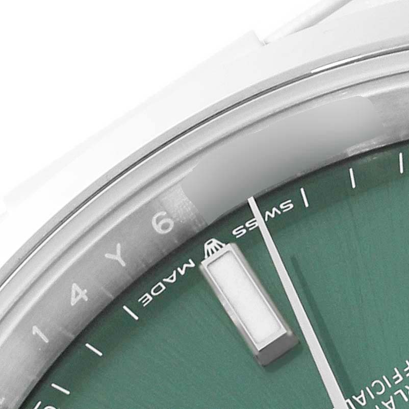 This image shows a close-up of a Rolex Datejust 41 126300 Men
s Stainless Steel Green Dial 126300 Men
s Stainless Steel Green Dial watch, focusing on the dial and part of the bezel.