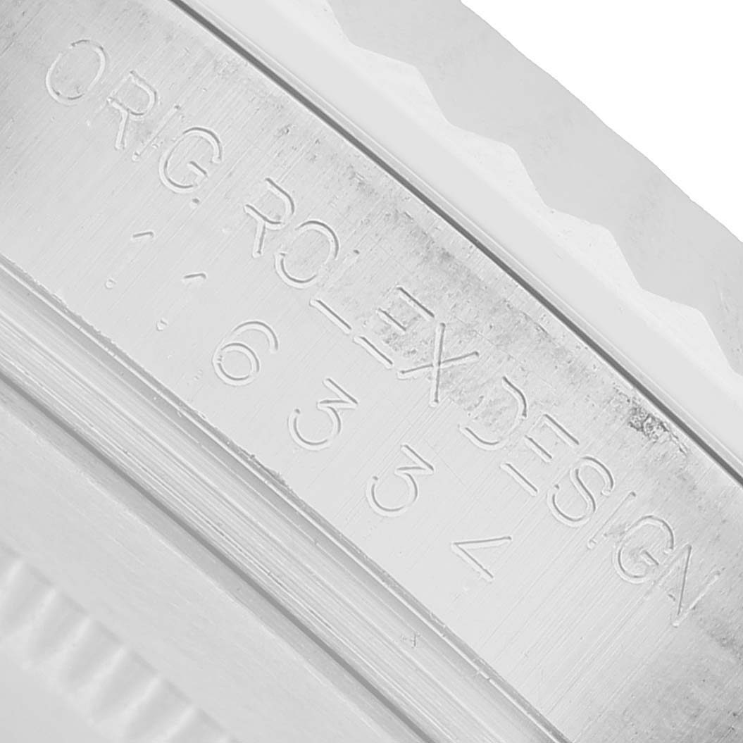 The image shows a close-up of the engraving on the side of the case back of a Rolex Datejust 41 116334 Men's Stainless Steel Silver Dial.