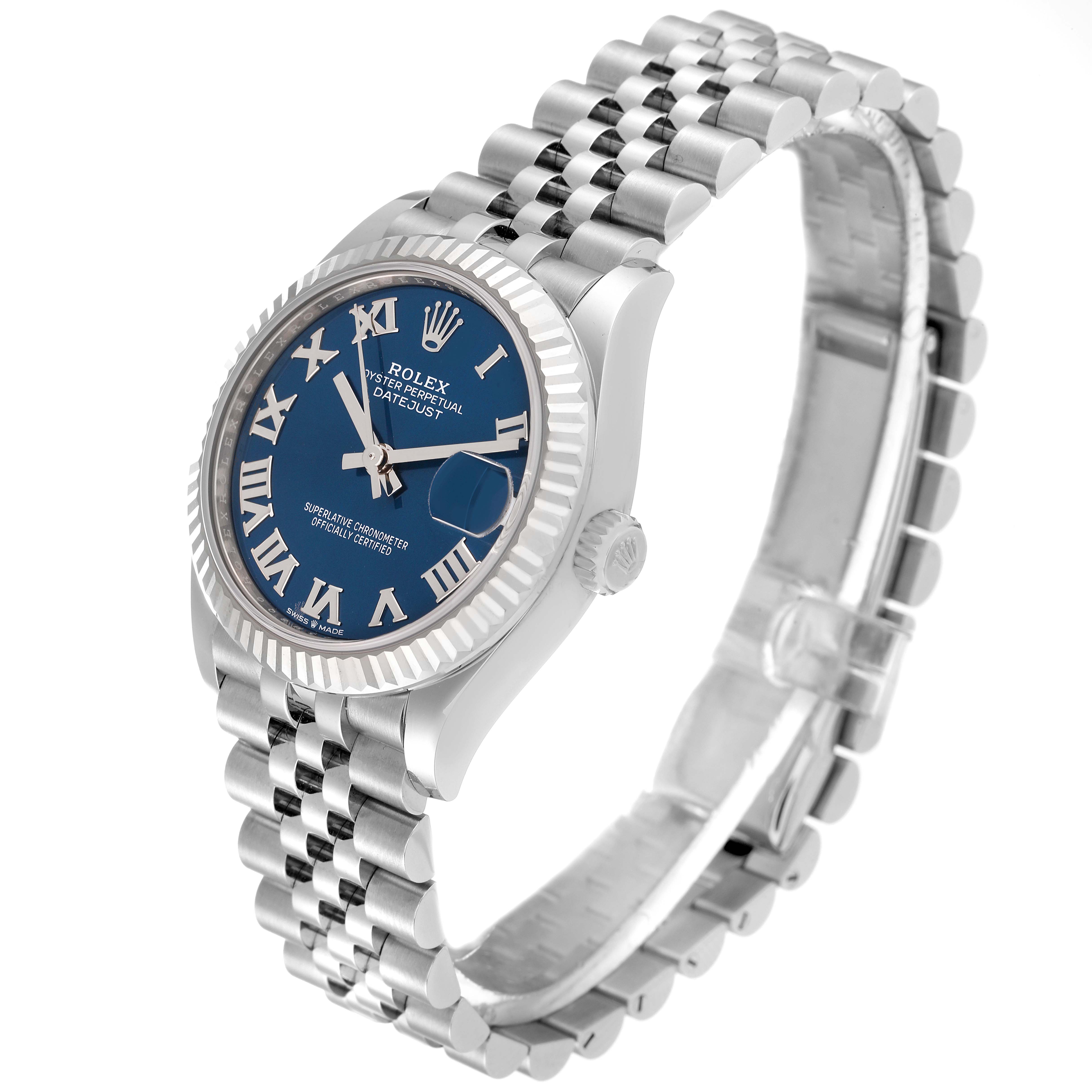 The image shows a side angle of a mid-size Rolex Datejust watch with a blue dial, Roman numerals, and a silver Jubilee bracelet.