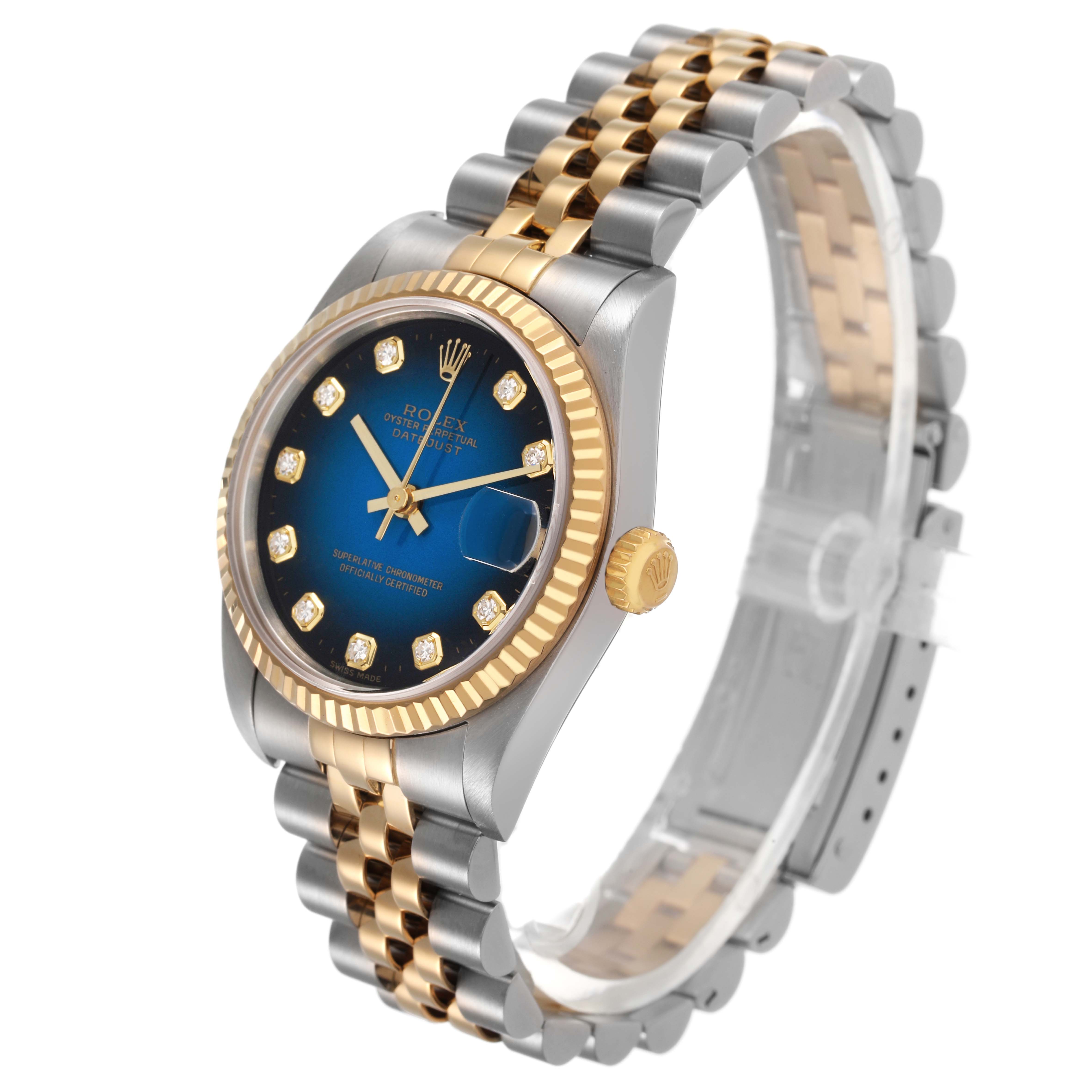 This Rolex Mid-Size 78273 Women's Steel and Gold (two tone) Blue Dial model shows a side angle featuring the bezel, crown, dial, and bracelet.