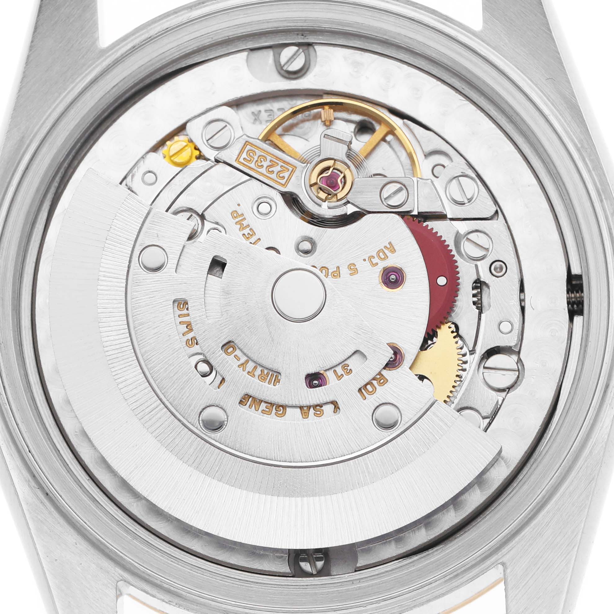 The image shows the movement of a Rolex Mid-Size 78273 Women's Steel and Gold (two tone) Blue Dial watch from the back, highlighting gears and the rotor.