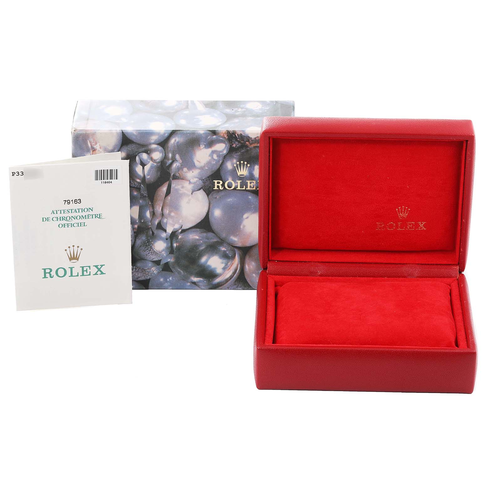 This image shows a red Rolex Datejust 79163 Women's Steel and Gold (two tone) Silver Dial 79163 Women's Steel and Gold (two tone) Silver Dial watch box, an outer box with a pearly design, and a certificate booklet.
