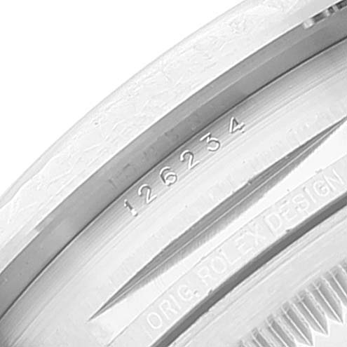 The image shows the edge of a Rolex Datejust 126234 Men's Stainless Steel Silver Dial 126234 Men's Stainless Steel Silver Dial watch case, revealing the model number "126234" and engraving "ORIG. ROLEX DESIGN.”