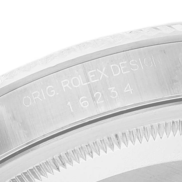 This image shows a close-up of the side bezel on a Rolex Datejust 16234 Men's Stainless Steel Blue Dial 16234 Men's Stainless Steel Blue Dial watch, displaying the "Orig. Rolex Design 16234" engraving.