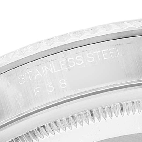 This close-up image shows the stainless steel case side and grooved bezel of a Rolex Datejust 16234 Men's Stainless Steel Blue Dial 16234 Men's Stainless Steel Blue Dial watch.