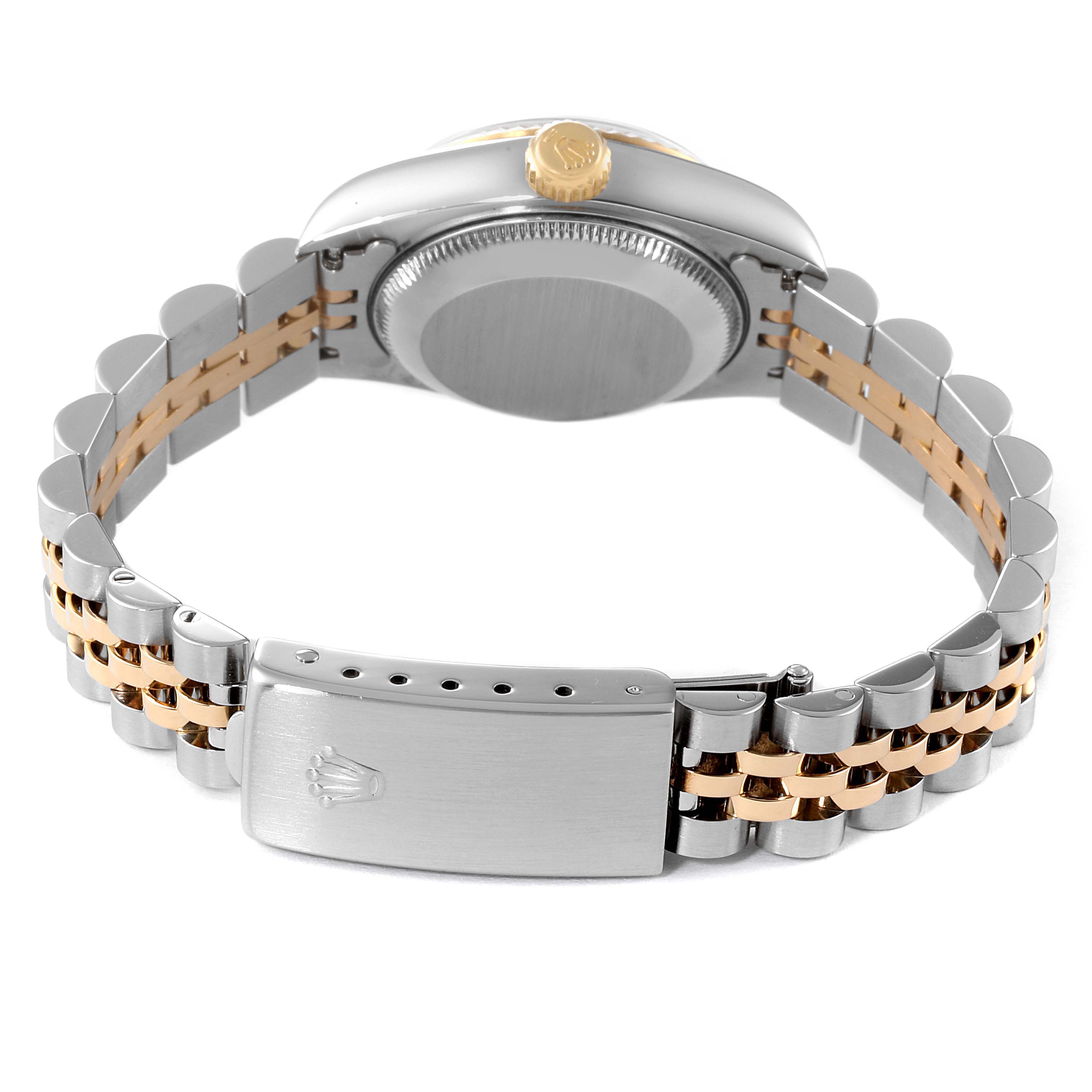 The Rolex Datejust 69173 Women's Steel and Gold (two tone) Silver Dial 69173 Women's Steel and Gold (two tone) Silver Dial watch is shown from the back, highlighting the case, crown, and two-tone jubilee bracelet with a clasp.