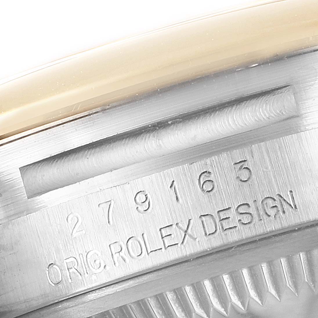 The image shows a close-up of the serial number engraving on the side of a Rolex Datejust 279163 Women
s Steel and Gold (two tone) Champagne Dial 279163 Women
s Steel and Gold (two tone) Champagne Dial watch case.