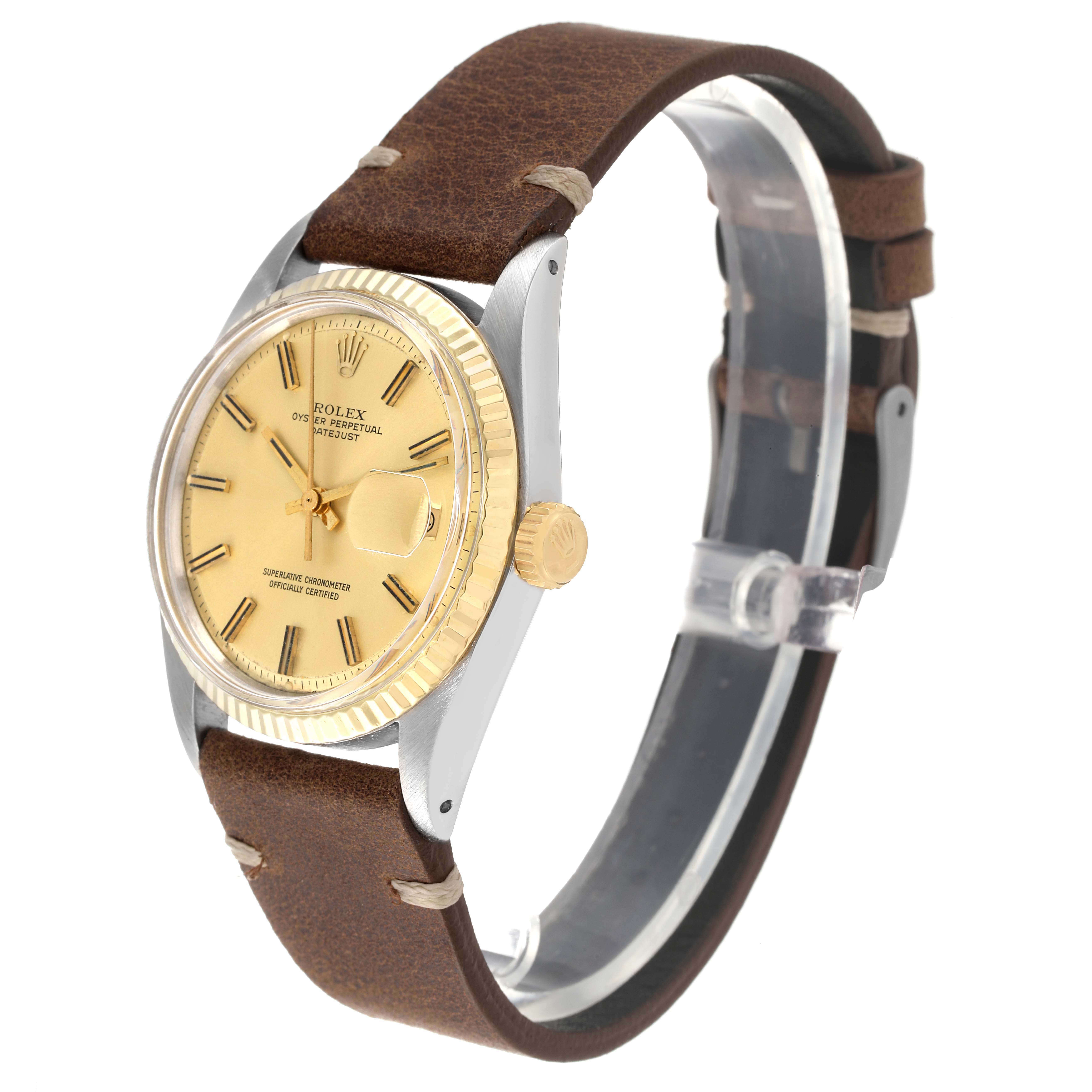 The image shows a Rolex Datejust 1601 Men
s Steel and Gold (two tone) Champagne Dial 1601 Men
s Steel and Gold (two tone) Champagne Dial watch at a slight side angle, highlighting its gold dial, fluted bezel, and brown leather strap.