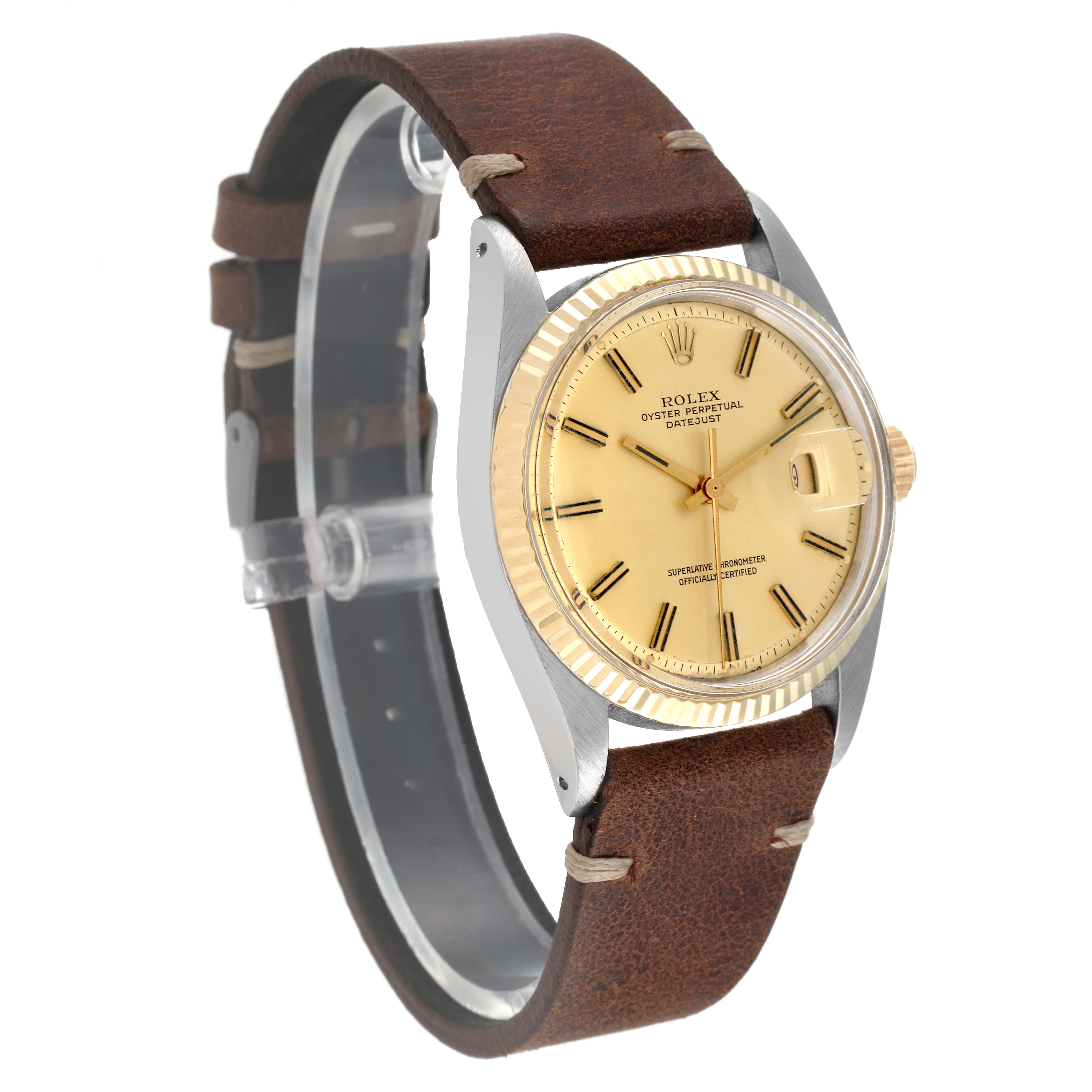 This Rolex Datejust 1601 Men
s Steel and Gold (two tone) Champagne Dial 1601 Men
s Steel and Gold (two tone) Champagne Dial watch is shown at a slight angle, displaying its face, bezel, crown, and brown leather strap.