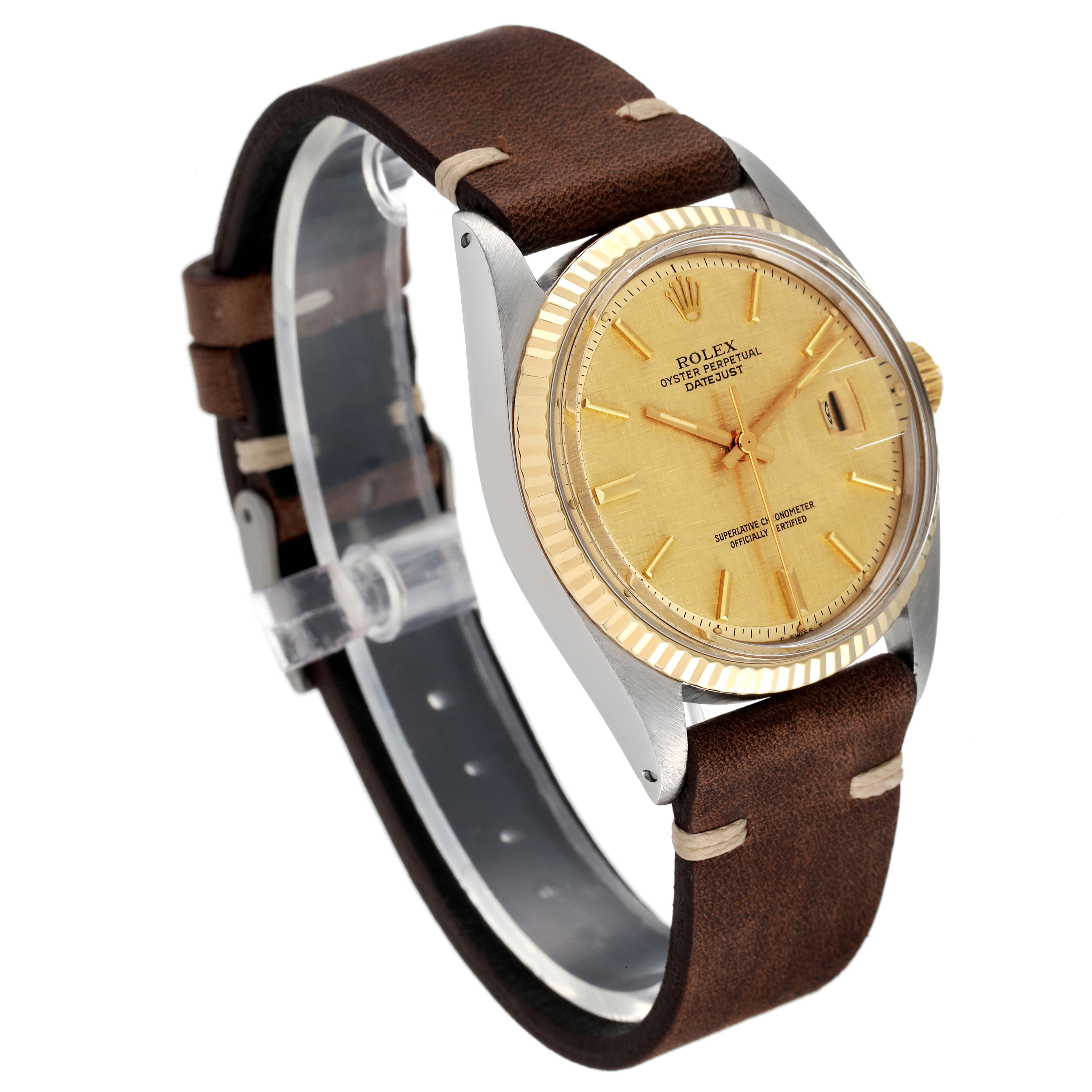 This image shows a Rolex Datejust 1601 Men
s Steel and Gold (two tone) Champagne Dial 1601 Men
s Steel and Gold (two tone) Champagne Dial watch at a slight angle, highlighting its brown leather strap, gold dial, and fluted bezel.