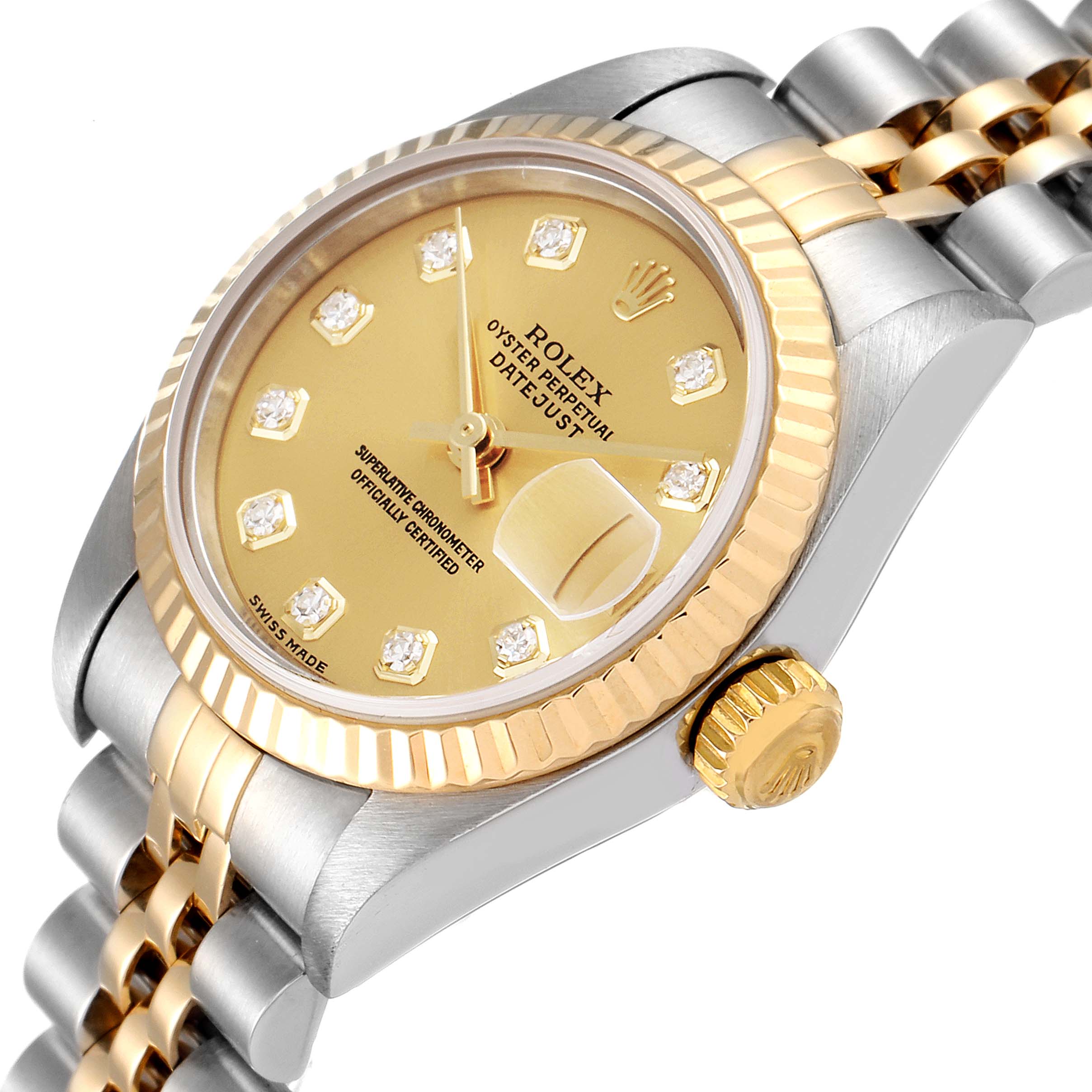 The image shows a Rolex Datejust 79173 Women
s Steel and Gold (two tone) Champagne Dial 79173 Women
s Steel and Gold (two tone) Champagne Dial watch from an angled side view, highlighting the face, crown, and part of the bracelet.