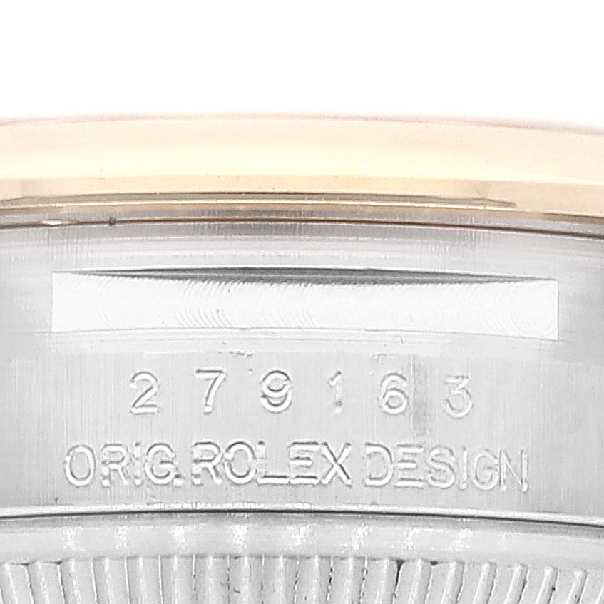 This image shows the serial number and "ORIG. ROLEX DESIGN" engraving on the side of the Rolex Datejust 279163 Women's Steel and Gold (two tone) White Dial 279163 Women's Steel and Gold (two tone) White Dial watch case.