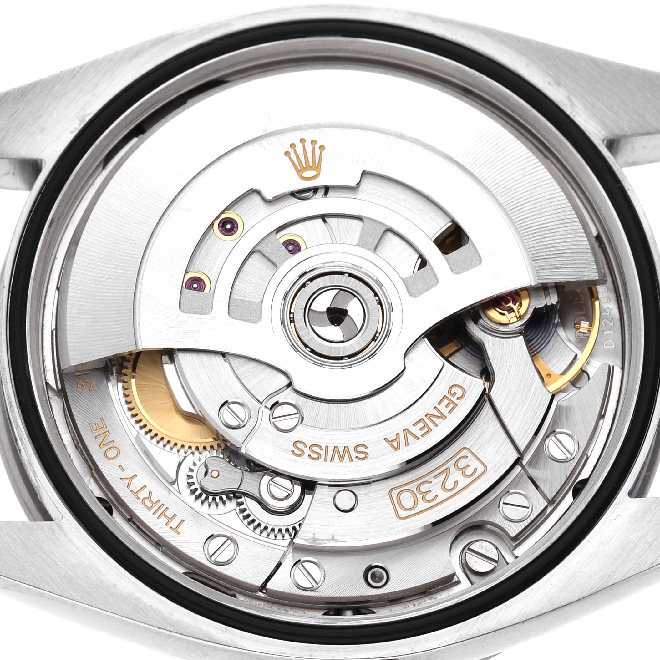 This image shows the movement of a Rolex Explorer 124270 Men's Stainless Steel Black Dial watch, featuring gears and the rotor at a close-up angle.
