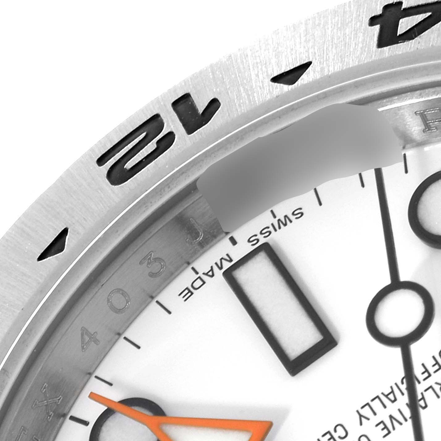 This image shows a close-up of the dial and partially the bezel of a Rolex Explorer 216570 Men's Stainless Steel White Dial 216570 Men's Stainless Steel White Dial watch.