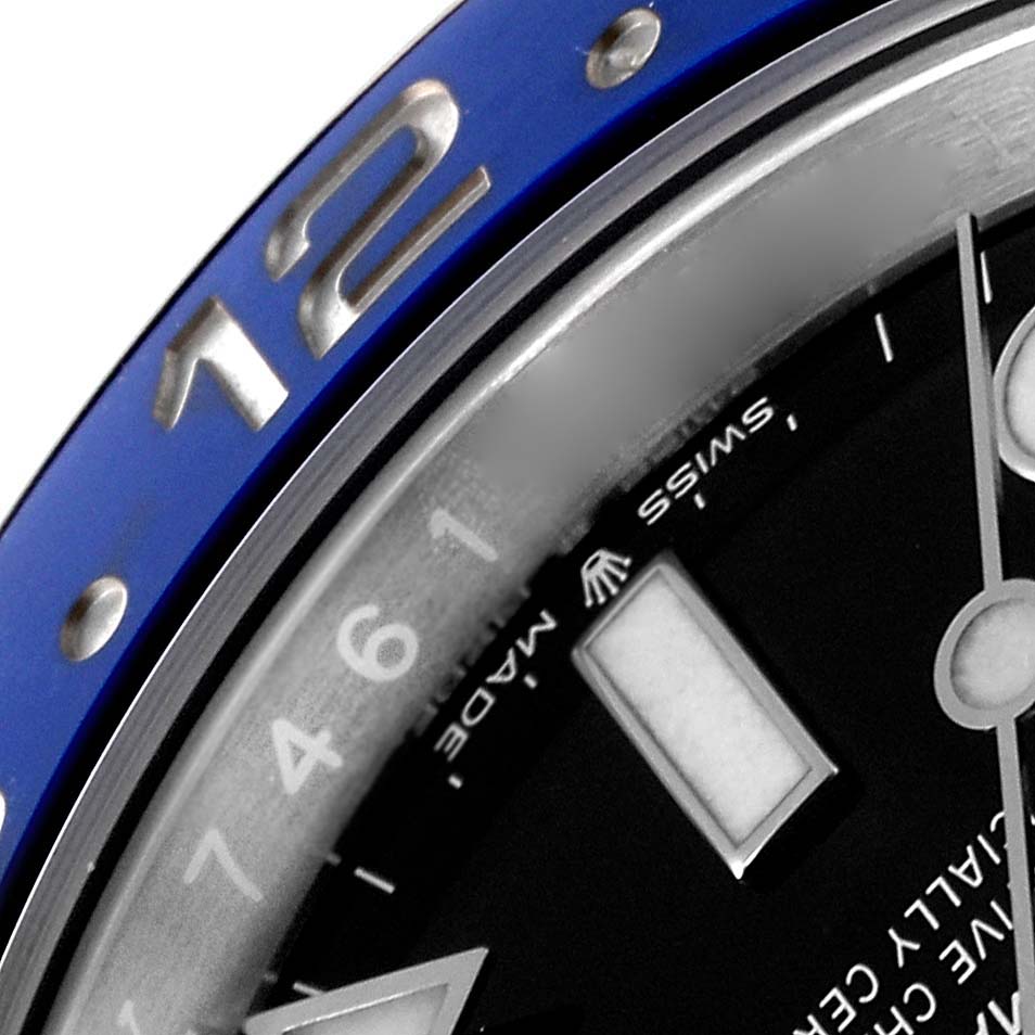 The image shows a close-up of the bezel and part of the dial of a Rolex GMT-Master 126710 Men
s Stainless Steel Black Dial 126710 Men
s Stainless Steel Black Dial watch.