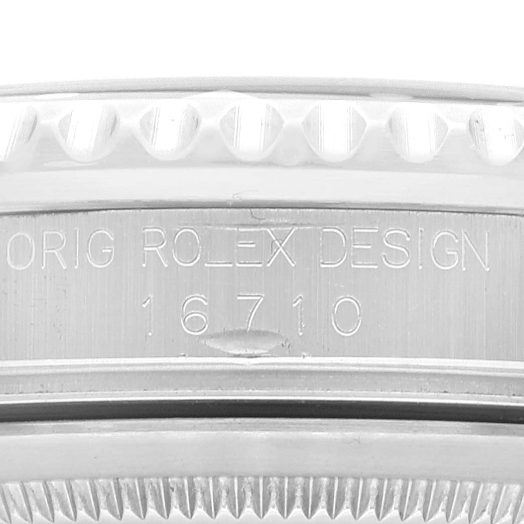 This is a close-up image of the engraved side of a Rolex GMT-Master 16710 Men
s Stainless Steel Black Dial 16710 Men
s Stainless Steel Black Dial watch, showing the model number 16710.