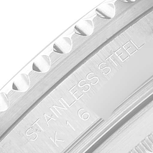 This close-up image shows the engraved "STAINLESS STEEL" marking on the bezel of a Rolex GMT-Master 16710 Men's Stainless Steel Black Dial 16710 Men's Stainless Steel Black Dial watch.