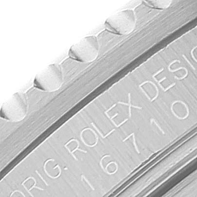 Close-up of the Rolex GMT-Master 16710 Men's Stainless Steel Black Dial 16710 Men's Stainless Steel Black Dial watch bezel and engraved text.