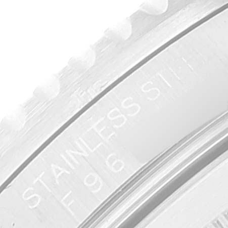 This close-up image shows part of the stainless steel bezel of a Rolex GMT-Master 16710 Men's Stainless Steel Black Dial 16710 Men's Stainless Steel Black Dial watch.