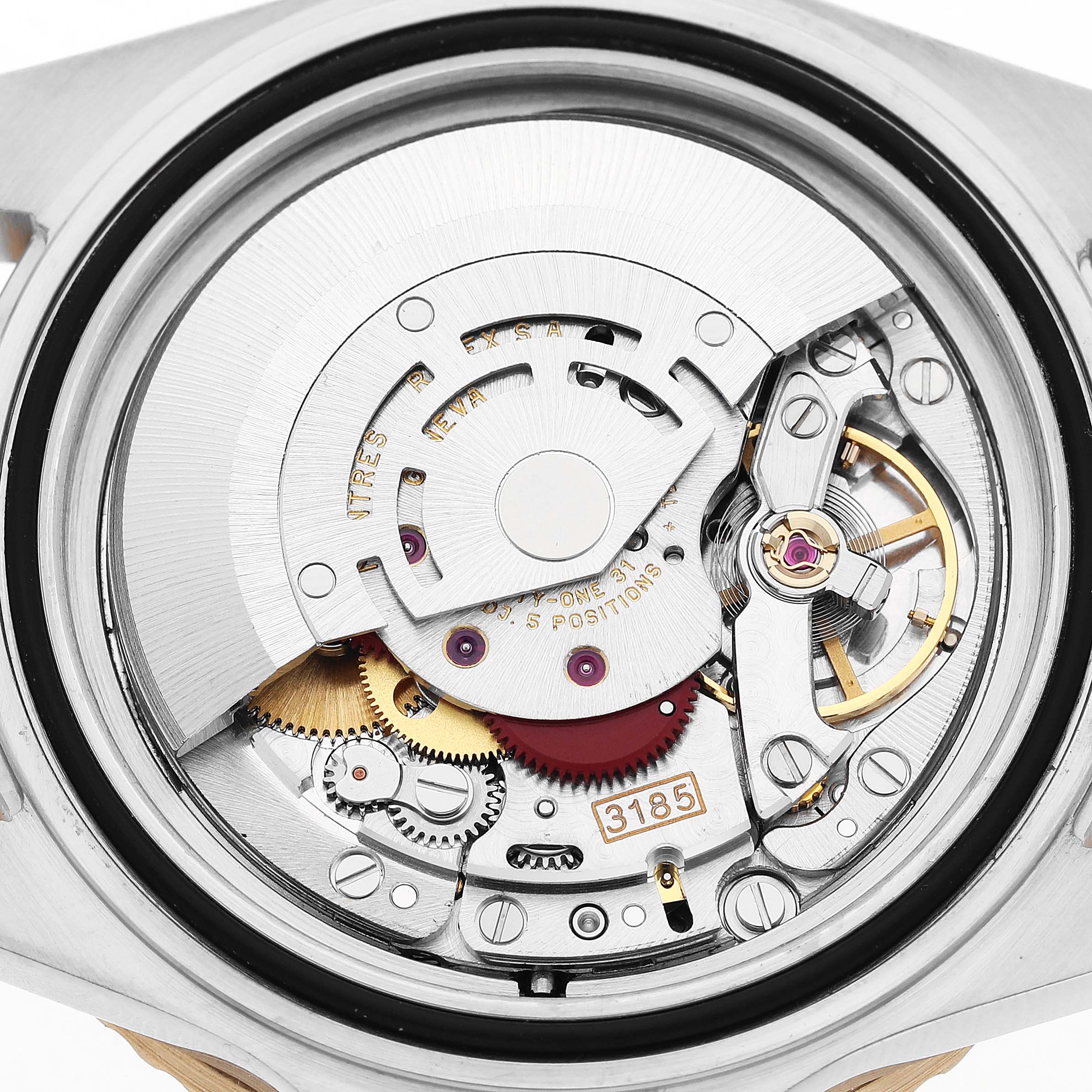 The image shows the movement's intricate components inside a Rolex GMT-Master 16713 Men's Steel and Gold (two tone) Black Dial watch at a close-up angle.