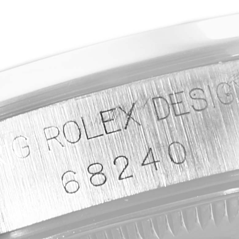 The image shows a close-up of the case back of a Rolex Mid-Size 68240 Women
s Stainless Steel Blue Dial 68240 Women
s Stainless Steel Blue Dial model, detailing the model number 68240.