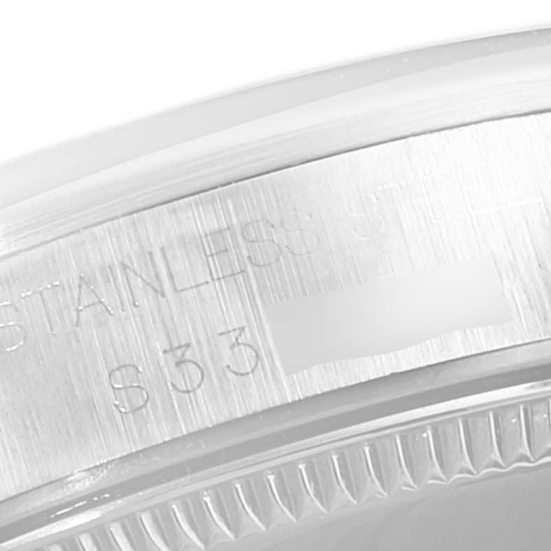 This image shows a close-up of the stainless steel case back edge with engravings on a Rolex Mid-Size 68240 Women
s Stainless Steel Blue Dial 68240 Women
s Stainless Steel Blue Dial model watch.