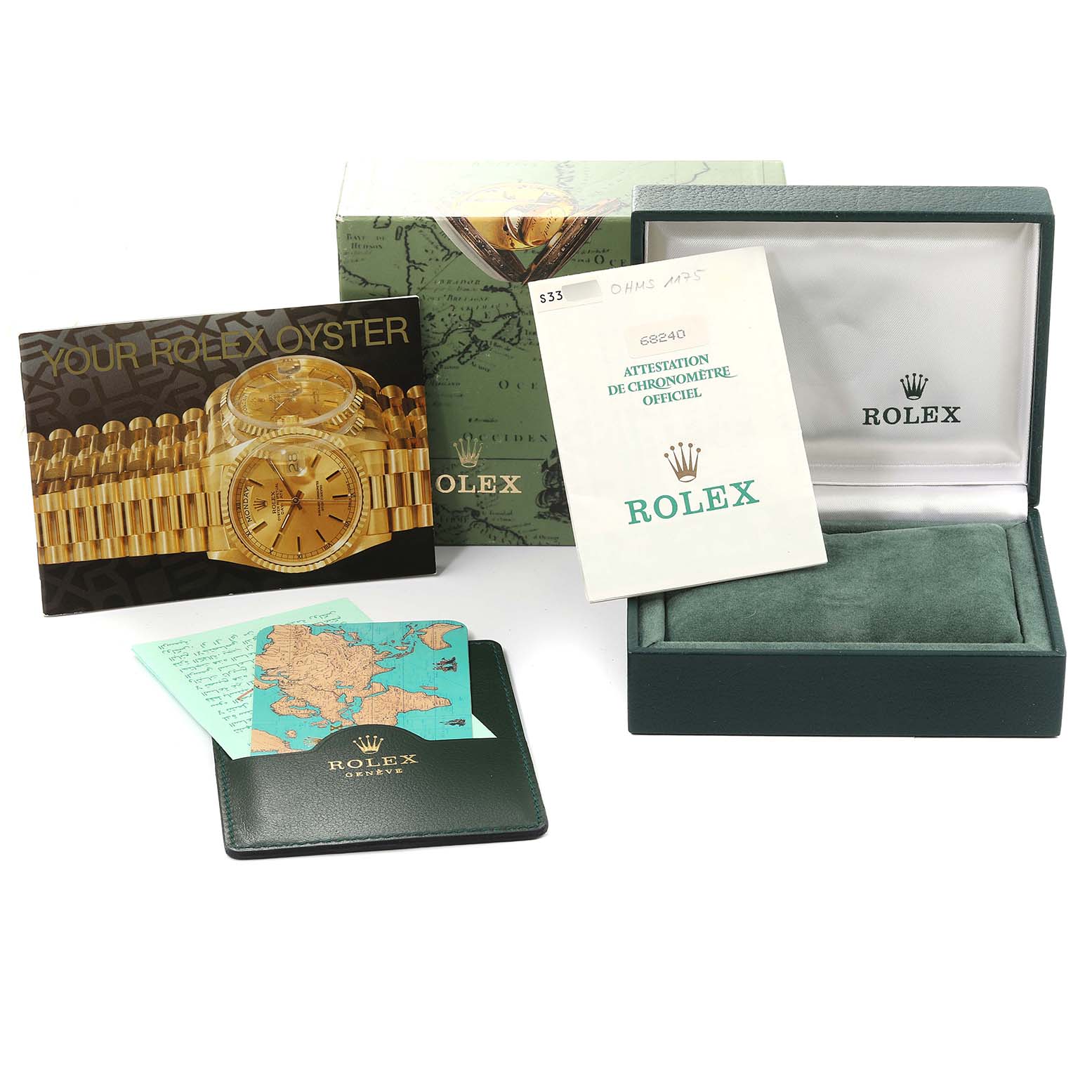 This image shows the package contents for a Rolex Mid-Size 68240 Women
s Stainless Steel Blue Dial 68240 Women
s Stainless Steel Blue Dial model, including the watch box, brochures, and certificate.