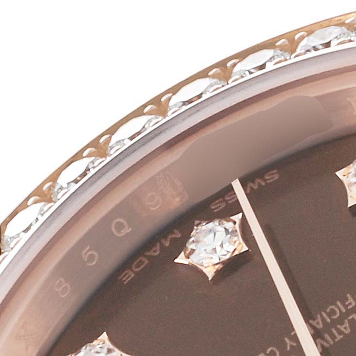 The image shows a partial view of the bezel and dial, including the minute hand and diamond markers, of the Rolex President 279135 Women's Rose Gold Brown Dial 279135 Women's Rose Gold Brown Dial model watch.