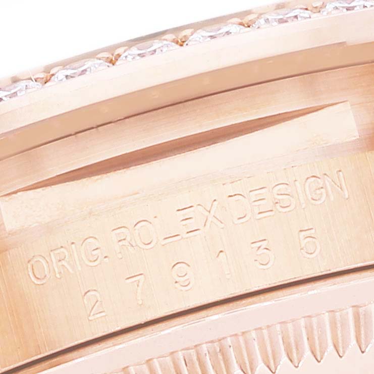 The image shows a close-up angle of the Rolex President 279135 Women's Rose Gold Brown Dial 279135 Women's Rose Gold Brown Dial model, focusing on the serial number and design inscription.