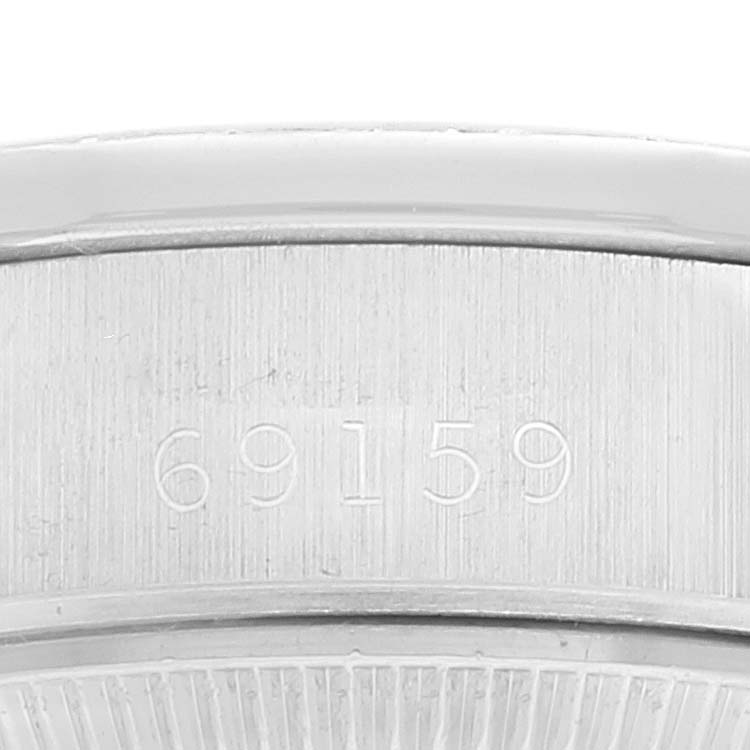 The image shows a close-up of the engraved reference number on the case back of a Rolex President 69159 Women's White Gold Silver Dial 69159 Women's White Gold Silver Dial model watch.