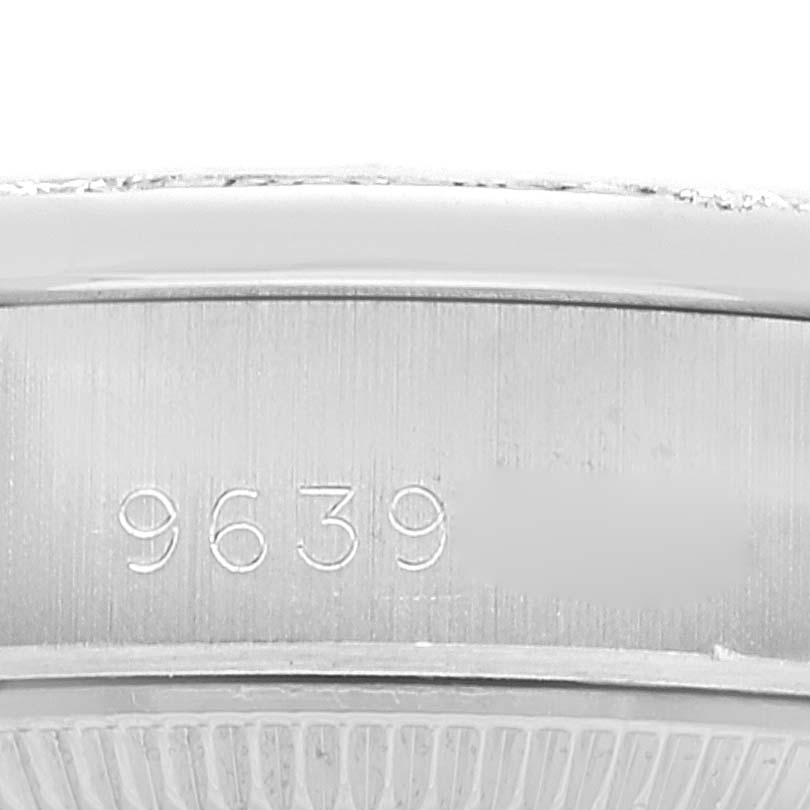 This close-up image shows the engraved serial number on the side of the casing of a Rolex President 69159 Women's White Gold Silver Dial 69159 Women's White Gold Silver Dial model watch.