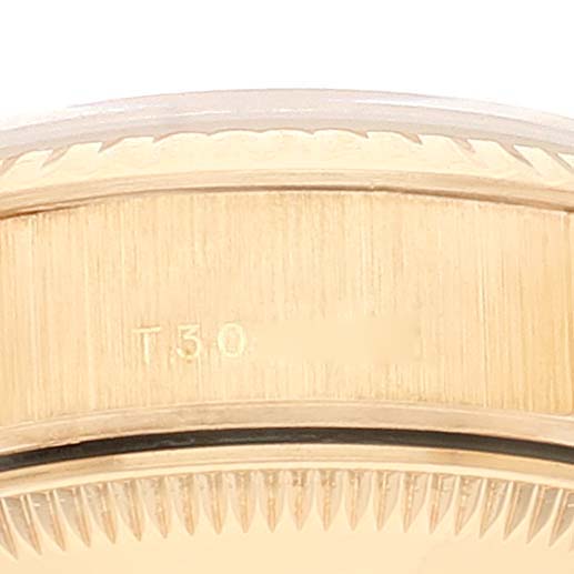 This image shows a close-up of the side of the bezel of a Rolex President 69178 Women
s Yellow Gold Champagne Dial 69178 Women
s Yellow Gold Champagne Dial model watch.