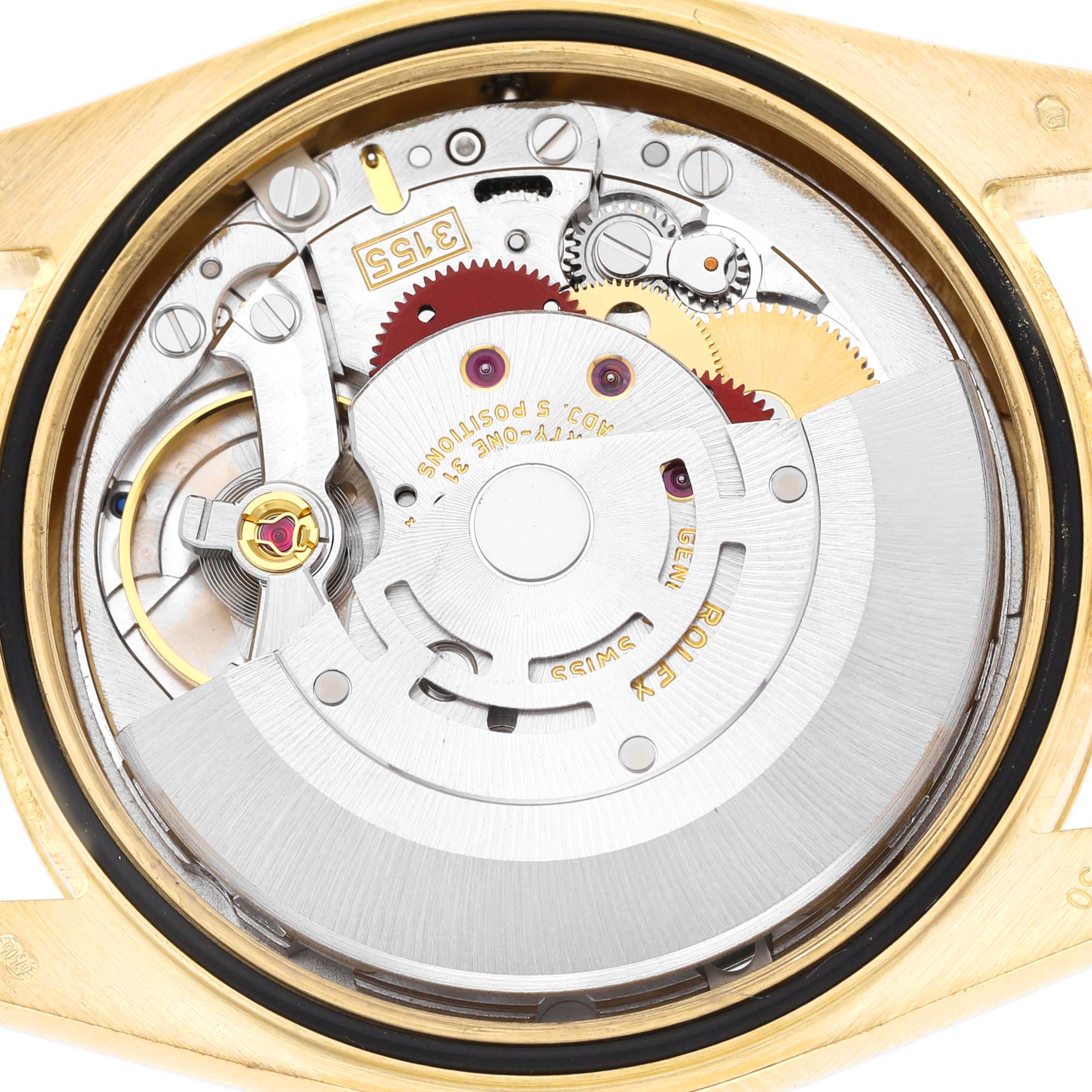 The image shows the movement of a Rolex President 118238 Men's Yellow Gold Champagne Dial watch, highlighting its intricate gears and components from a top angle.