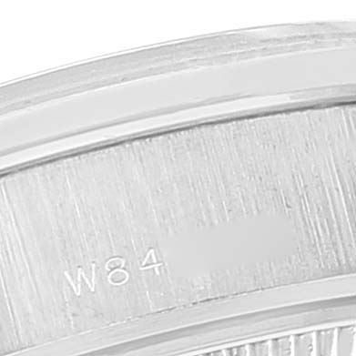 The image shows a close-up of the side and edge of a Rolex President 69136 Women's Platinum Silver Dial 69136 Women's Platinum Silver Dial model, including engraved markings.