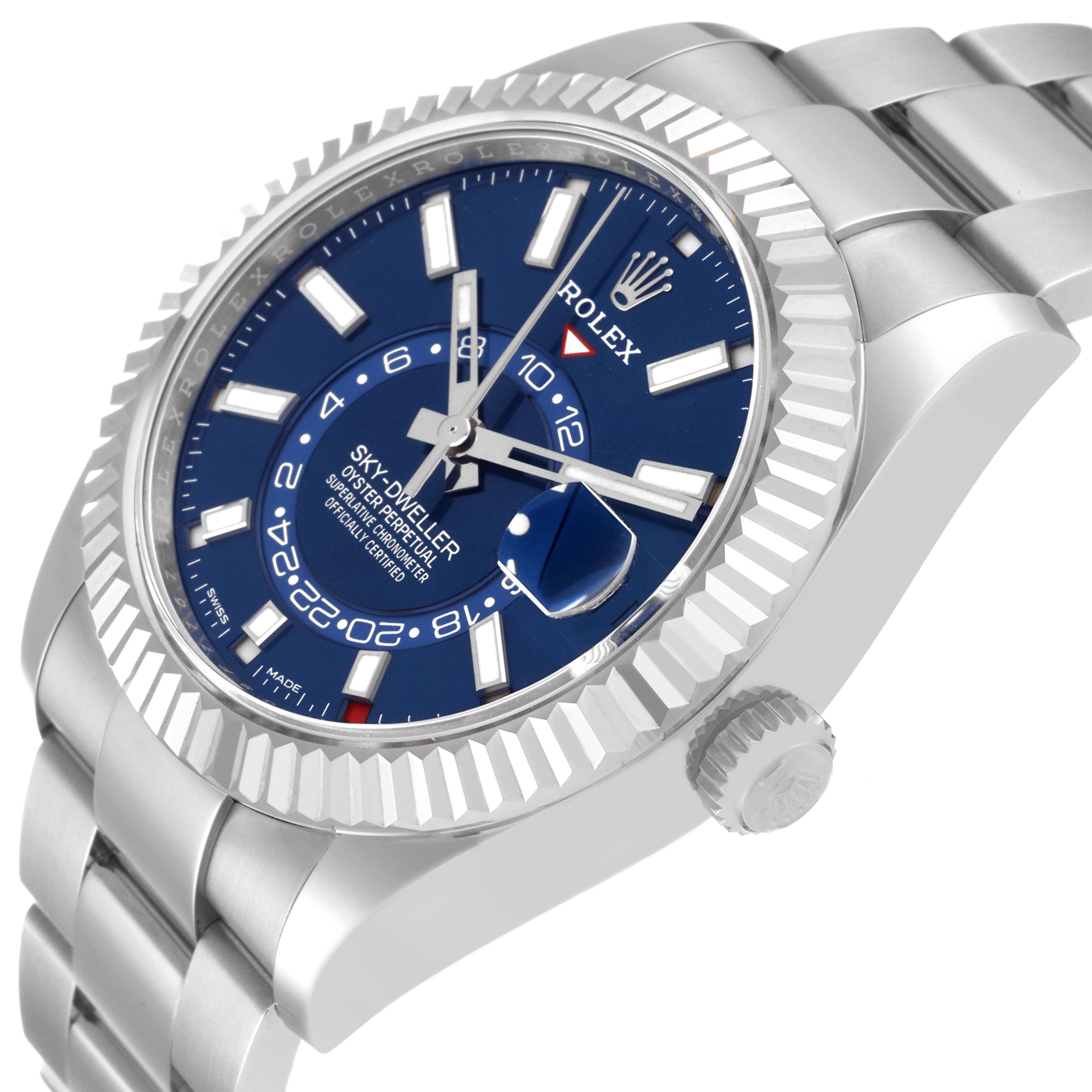 The image shows a close-up, side angle of a Rolex Sky-Dweller 326934 Men's Stainless Steel Blue Dial 326934 Men's Stainless Steel Blue Dial watch, highlighting the face, bezel, crown, and bracelet.