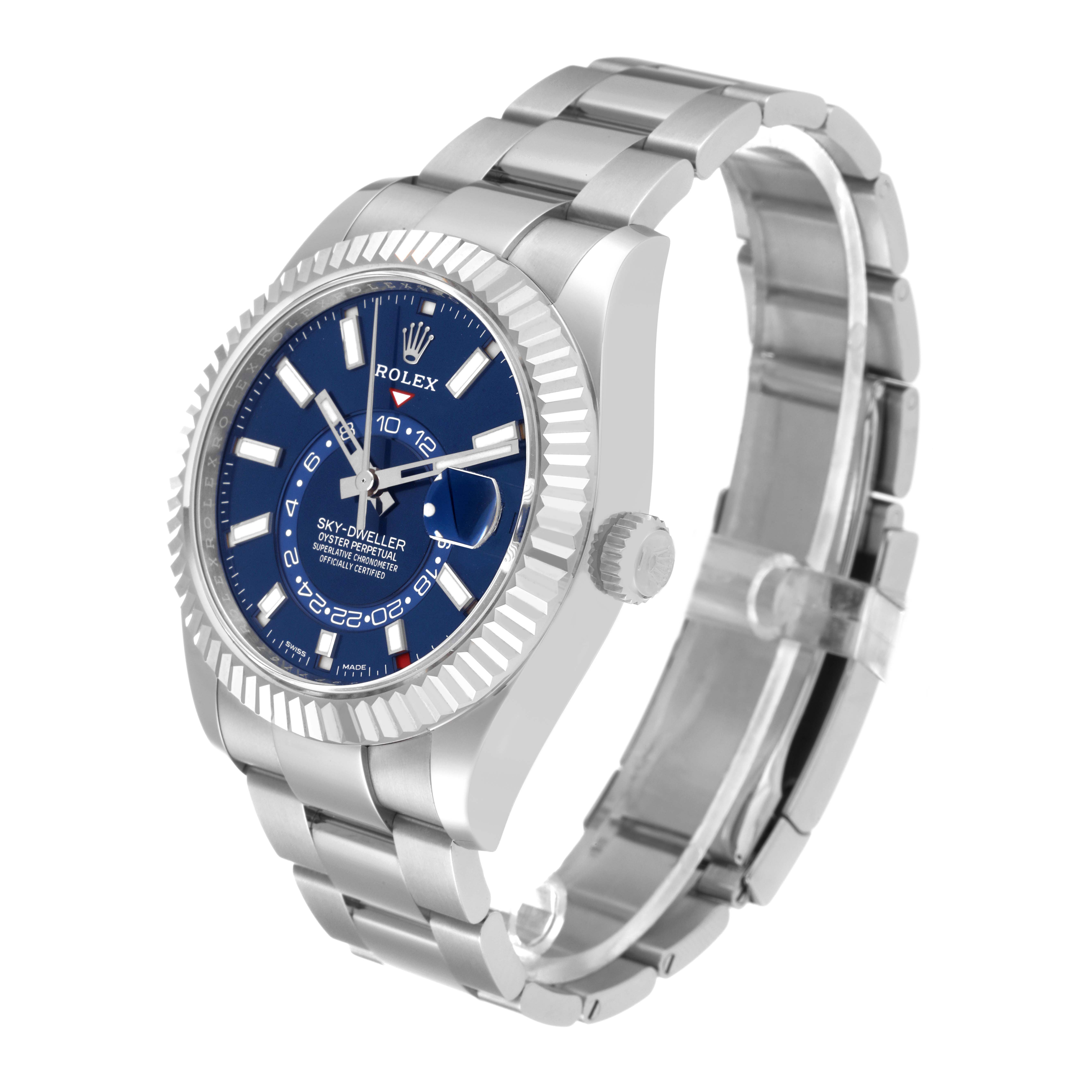 This image shows a side-angle view of a Rolex Sky-Dweller 326934 Men's Stainless Steel Blue Dial 326934 Men's Stainless Steel Blue Dial watch showcasing its blue dial, bezel, crown, and metal bracelet.