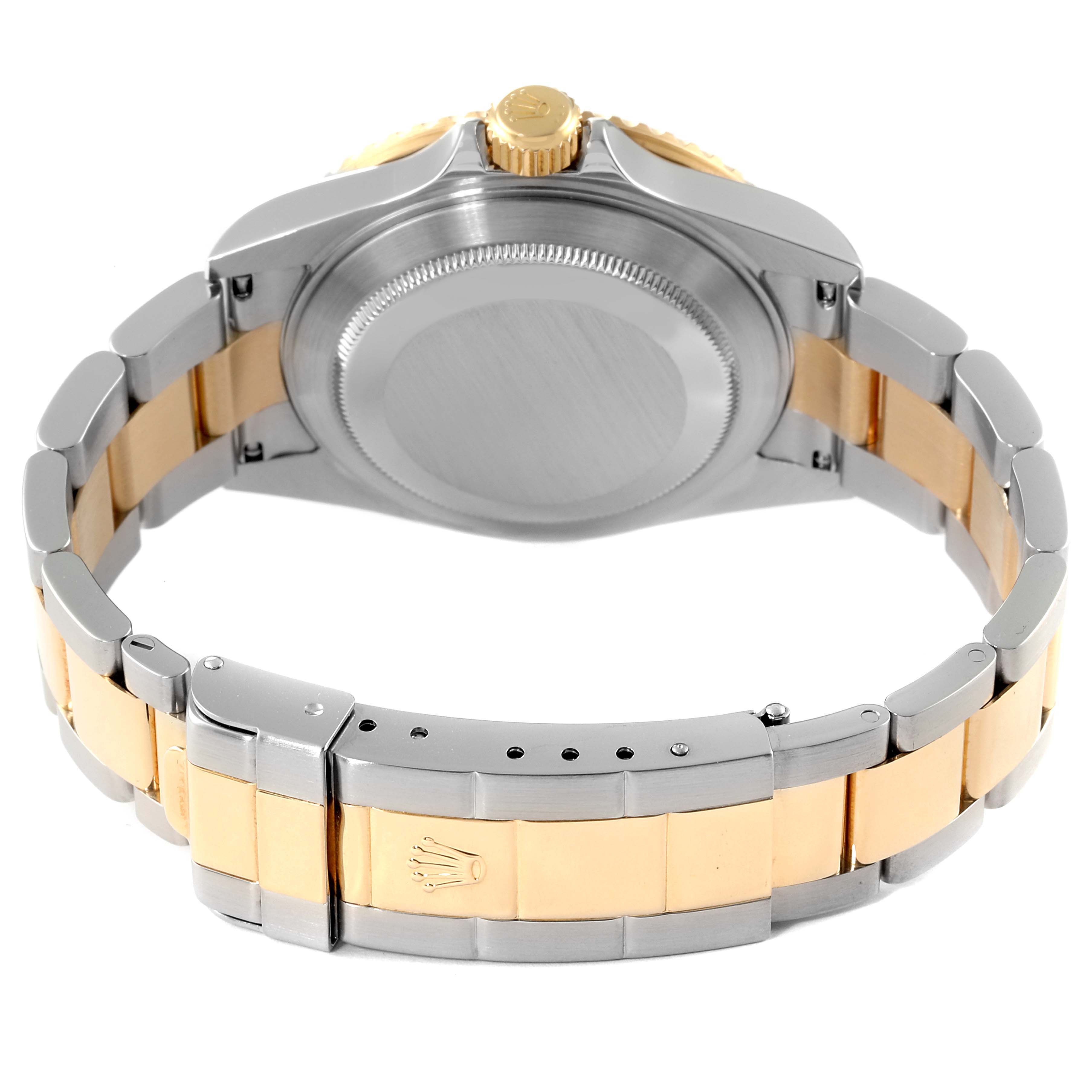 This image shows the back case, crown, and bracelet of the Rolex Submariner 16613 Men's Steel and Gold (two tone) Blue Dial 16613 Men's Steel and Gold (two tone) Blue Dial watch in a two-tone design.