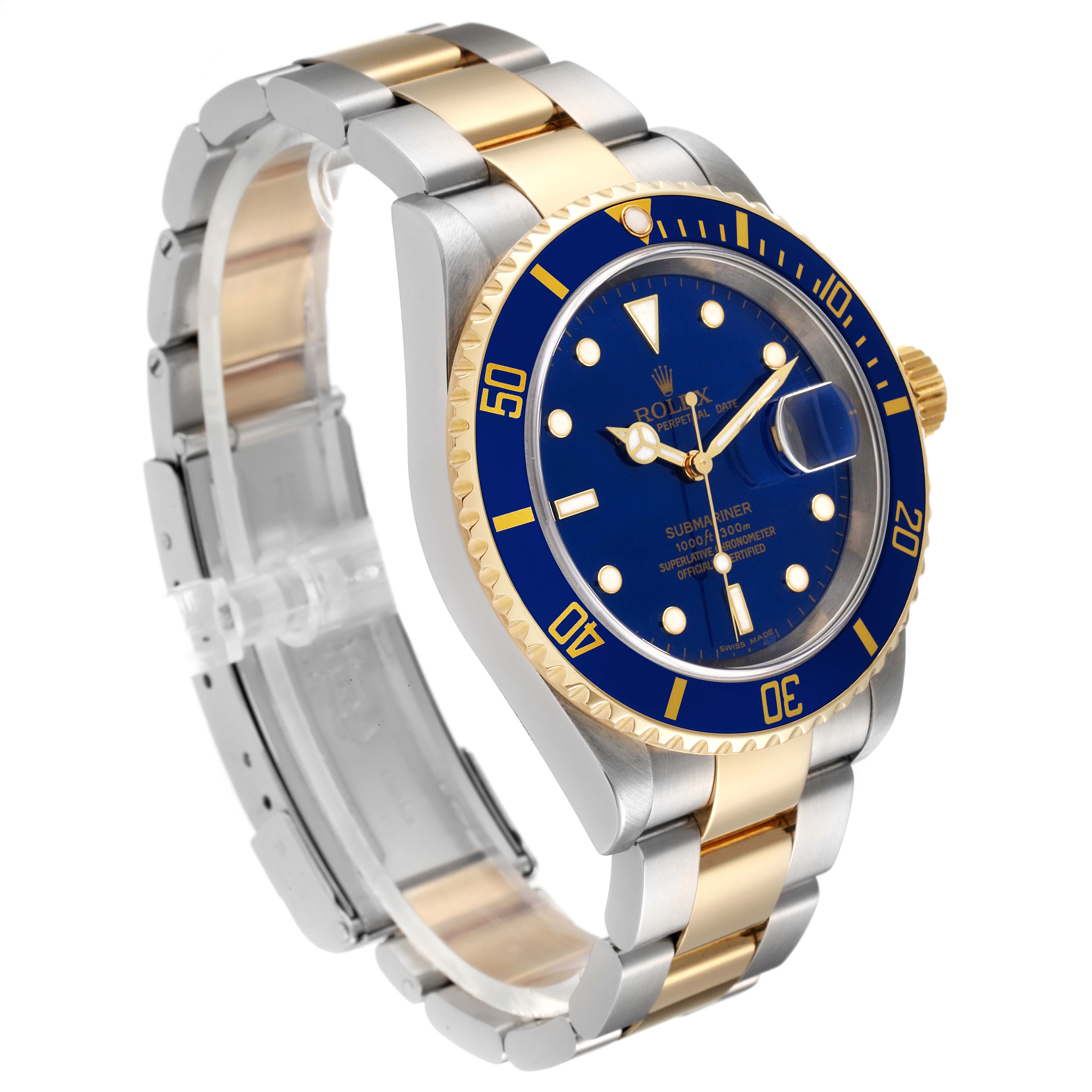 The image shows a Rolex Submariner 16613 Men's Steel and Gold (two tone) Blue Dial 16613 Men's Steel and Gold (two tone) Blue Dial watch at an angle showcasing its blue dial, bezel, and gold and stainless steel bracelet.