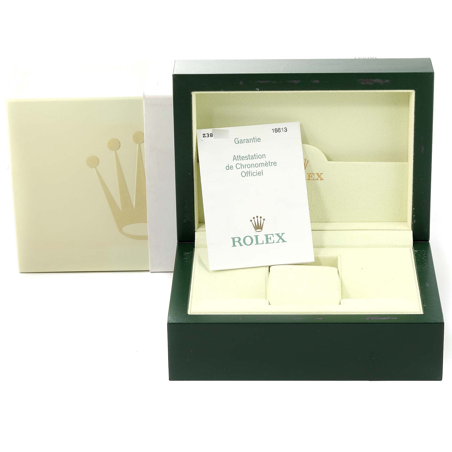 The image shows the open box of a Rolex Submariner 16613 Men
s Steel and Gold (two tone) Blue Dial 16613 Men
s Steel and Gold (two tone) Blue Dial watch with a warranty card placed inside.