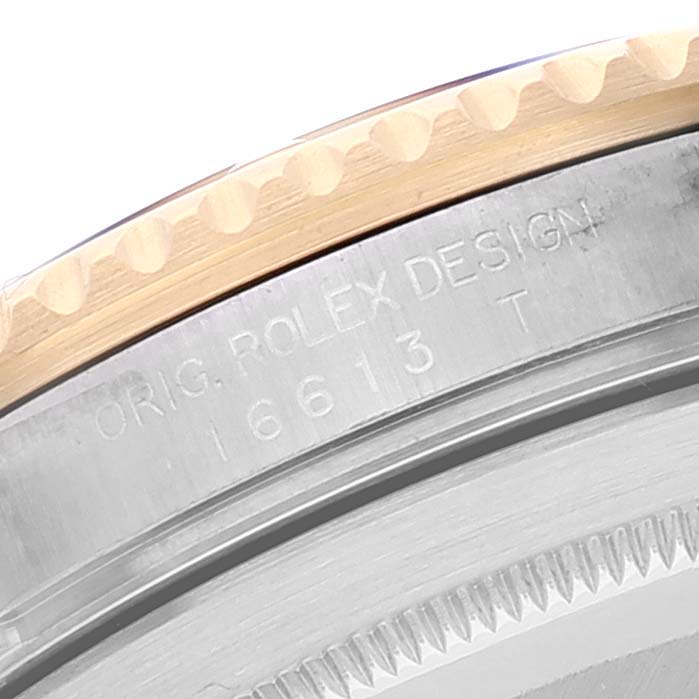 Close-up view of the bezel and engraved serial number of a Rolex Submariner 16613 Men
s Steel and Gold (two tone) Blue Dial 16613 Men
s Steel and Gold (two tone) Blue Dial watch.