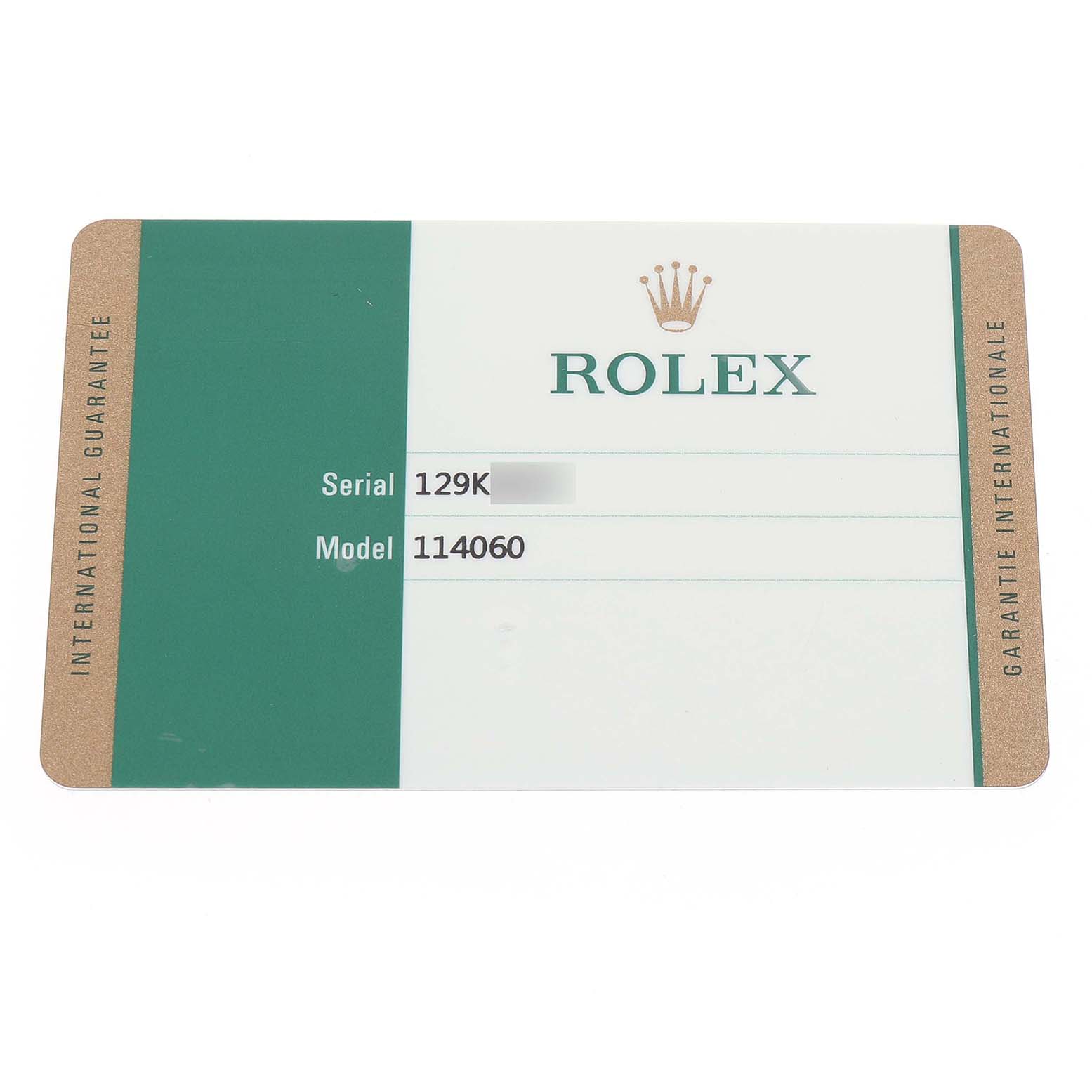 This image shows a green and white Rolex guarantee card for the Submariner model with identification details.