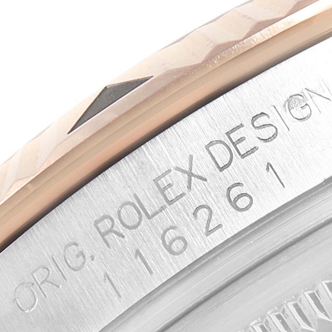 This close-up image shows the bezel and case back of a Rolex Turn-o-Graph 116261 Men
s Steel and Gold (two tone) Black Dial 116261 Men
s Steel and Gold (two tone) Black Dial watch, highlighting the engraved model number.