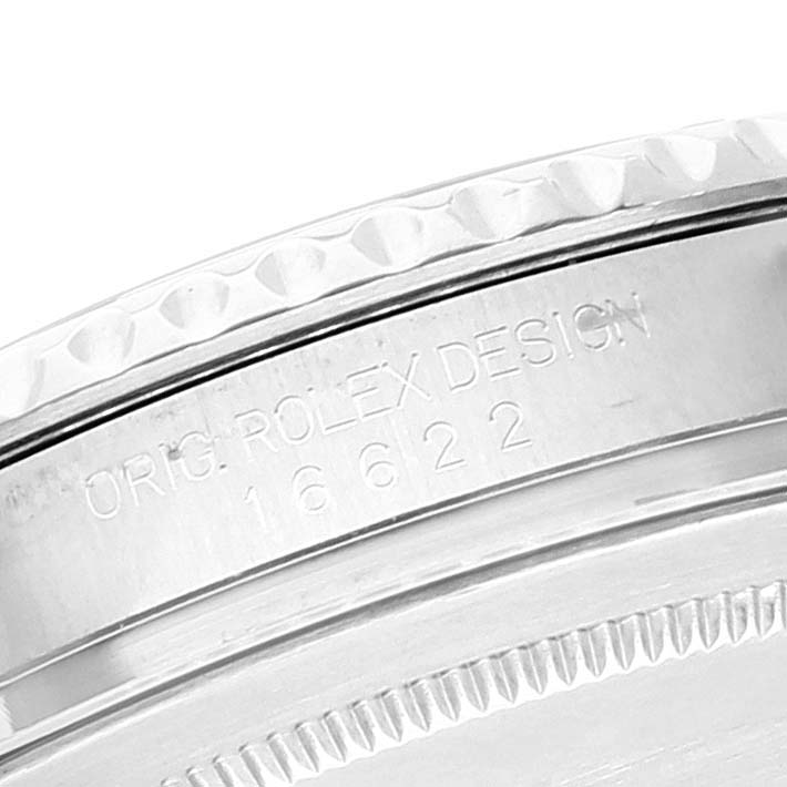 The image shows a close-up of the side of a Yacht-Master watch by Rolex, highlighting the engraving and part of the bezel.