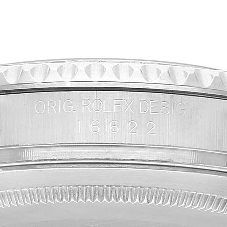 This image shows a close-up view of the case side of a Rolex Yacht-Master 16622 Men's Stainless Steel Silver Dial 16622 Men's Stainless Steel Silver Dial model, displaying the engraved serial number and text "ORIG. ROLEX DESIGN."