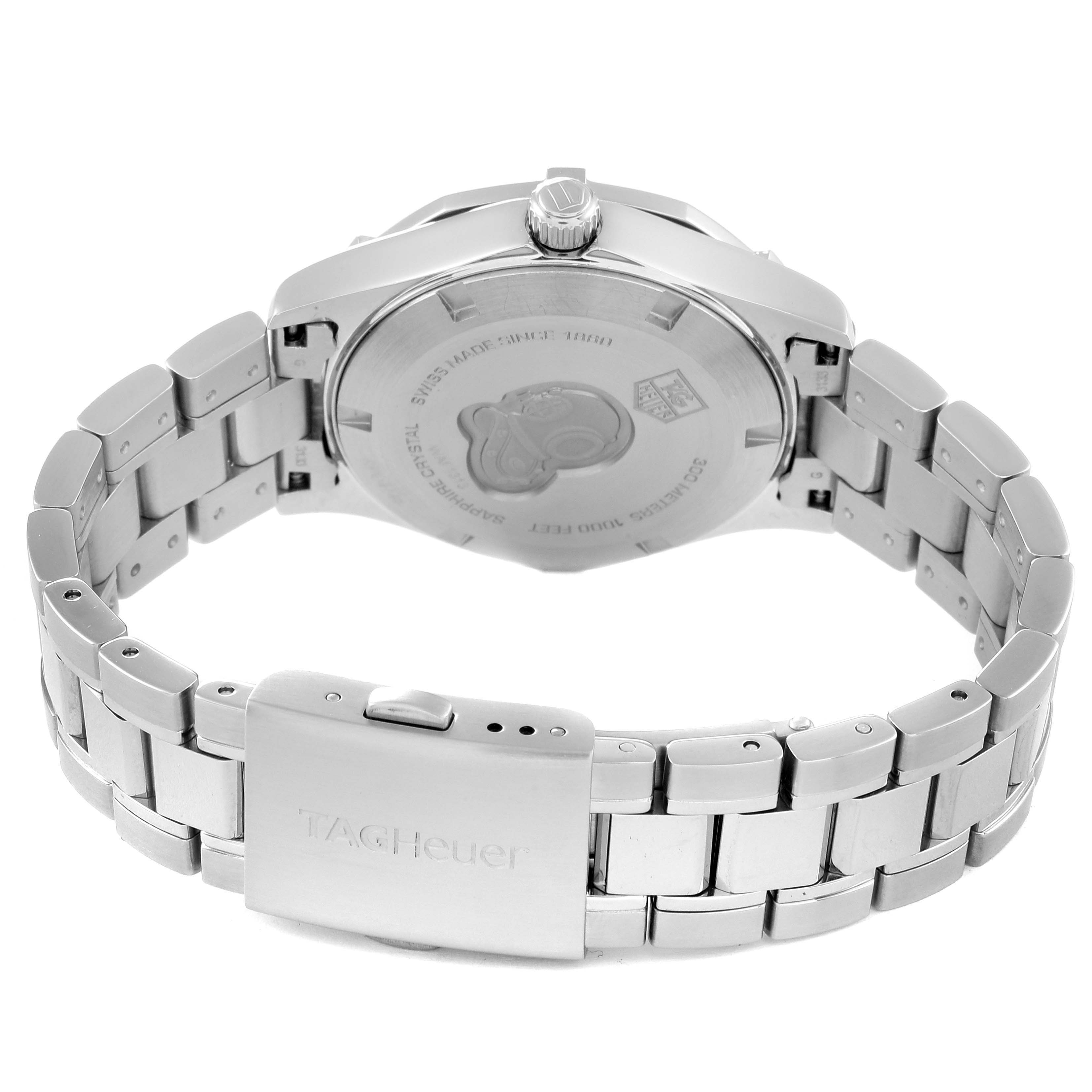 The image shows the back view of a Tag Heuer Aquaracer WAF1313.BA0819 Women's Stainless Steel Mother of Pearl Dial WAF1313.BA0819 Women's Stainless Steel Mother of Pearl Dial watch, focusing on its case back and clasp on the metal bracelet.