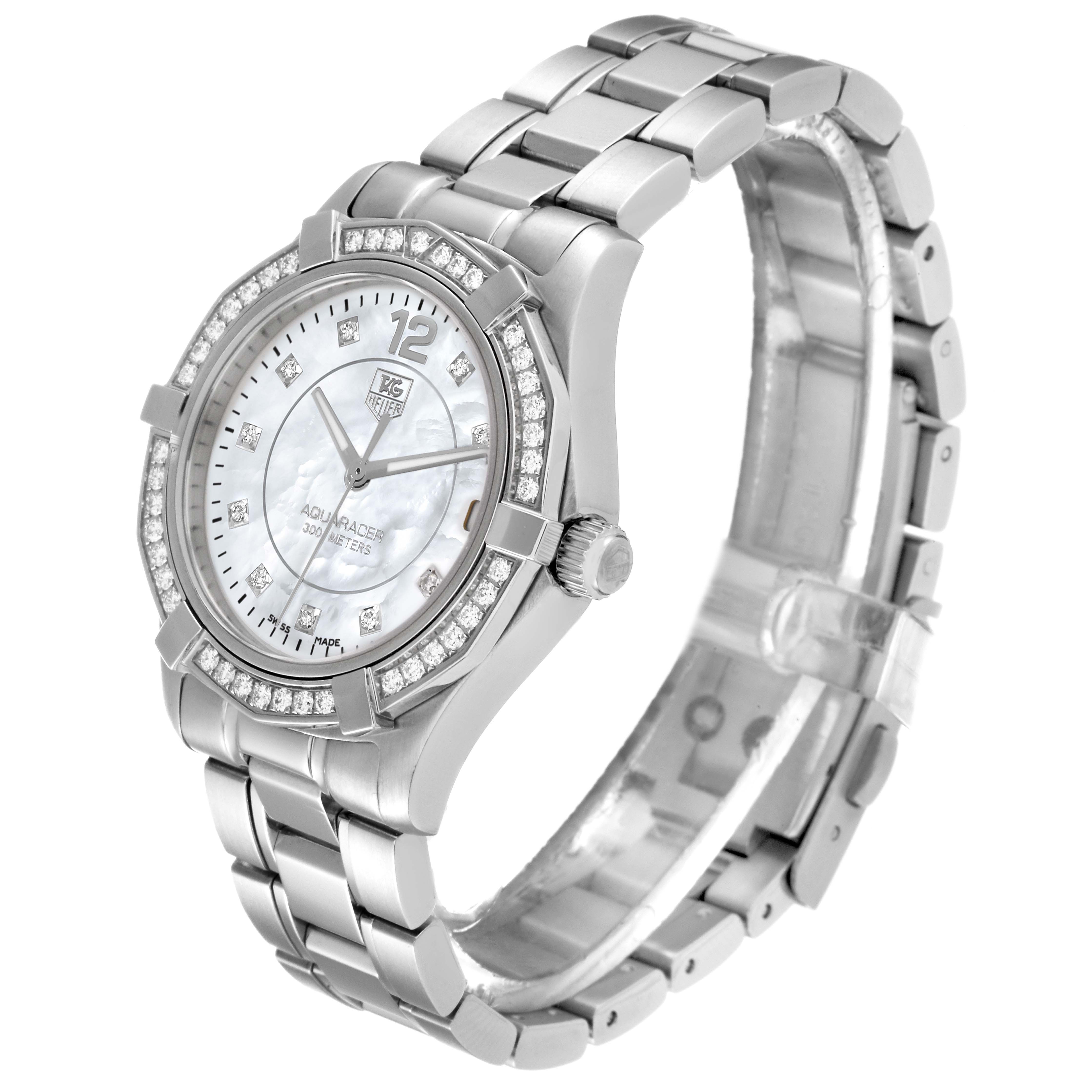 The image shows a side angle view of the Tag Heuer Aquaracer WAF1313.BA0819 Women's Stainless Steel Mother of Pearl Dial WAF1313.BA0819 Women's Stainless Steel Mother of Pearl Dial watch, highlighting its face, bezel, and stainless steel bracelet.