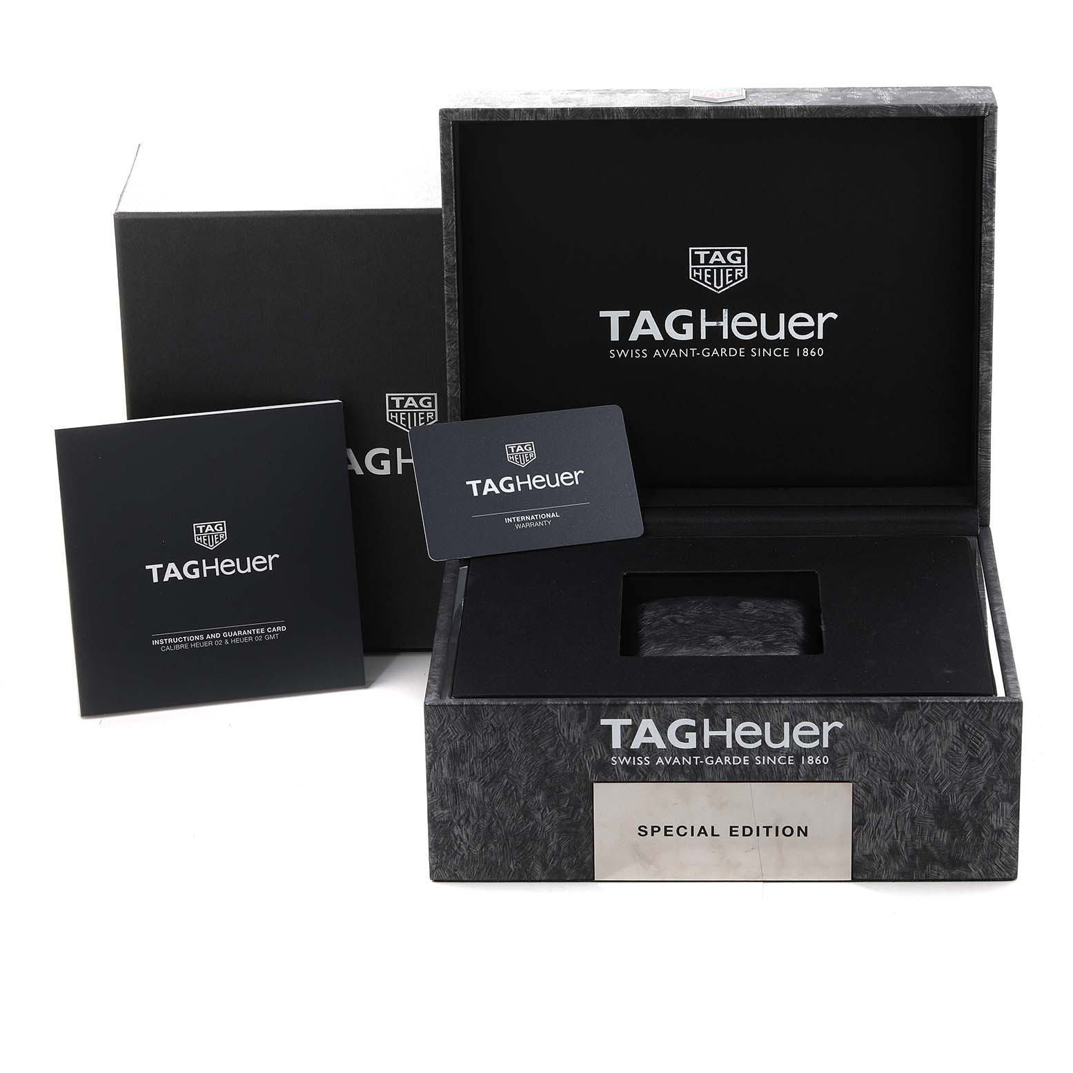 The image shows the open box for a Tag Heuer Carrera CBG2052.FT6143 Men's Ceramic Black Dial CBG2052.FT6143 Men's Ceramic Black Dial watch, including a booklet and an international guarantee card.