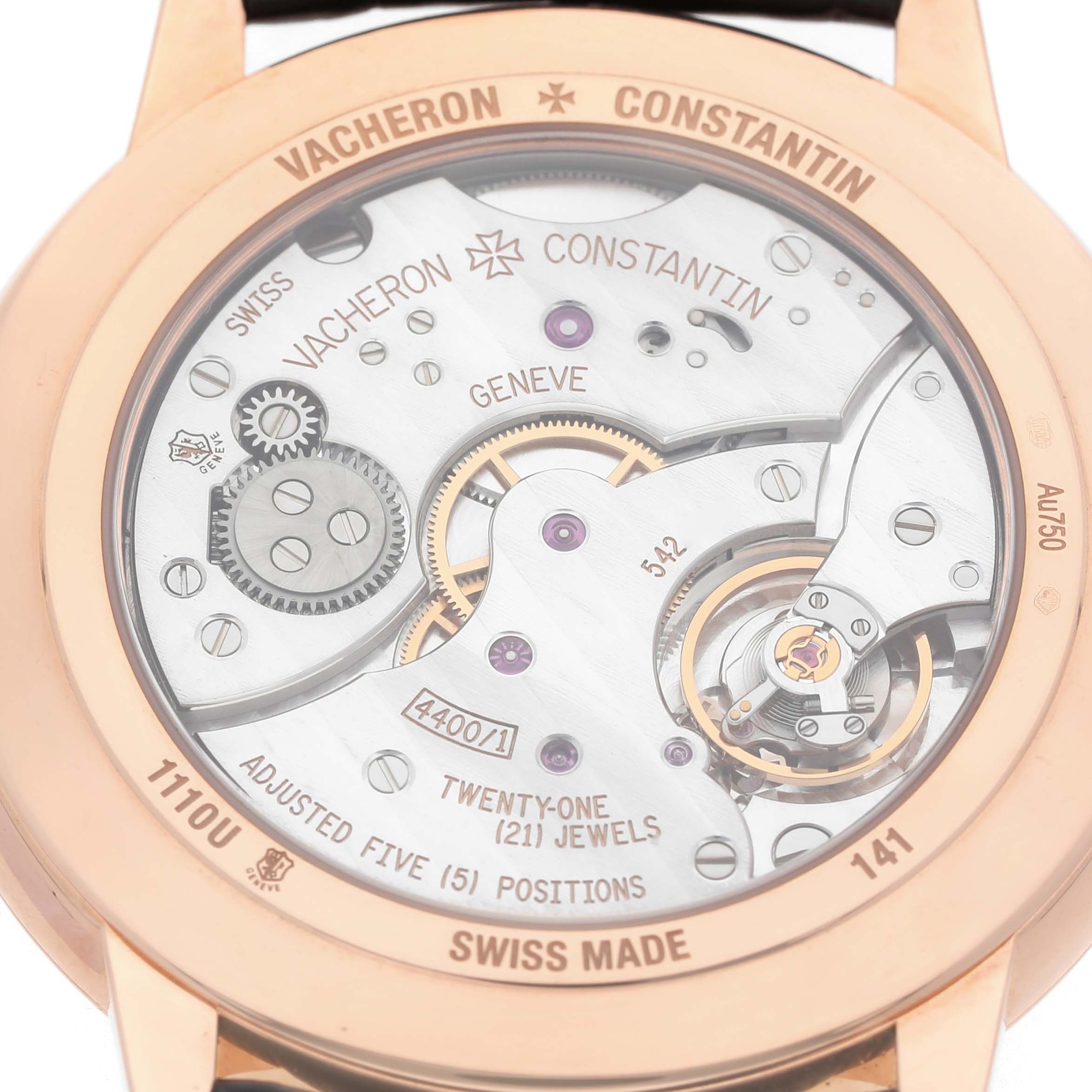 The image shows the back of the Vacheron Constantin Patrimony 1110U/000R Men's Rose Gold Silver Dial, revealing its mechanical movement and engravings.