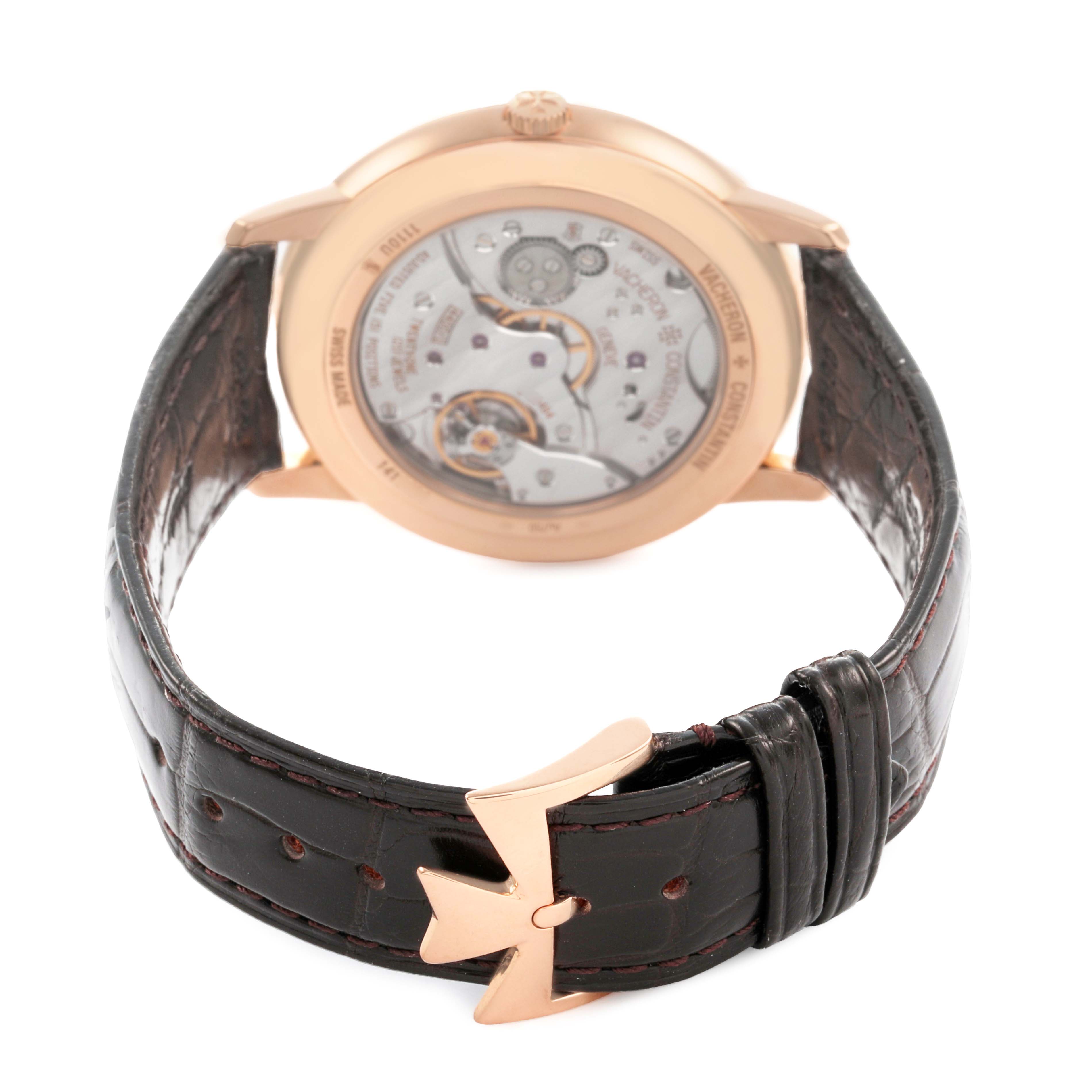 The Vacheron Constantin Patrimony 1110U/000R Men's Rose Gold Silver Dial watch is shown from the back, highlighting its open case back and strap with a distinctive gold buckle.